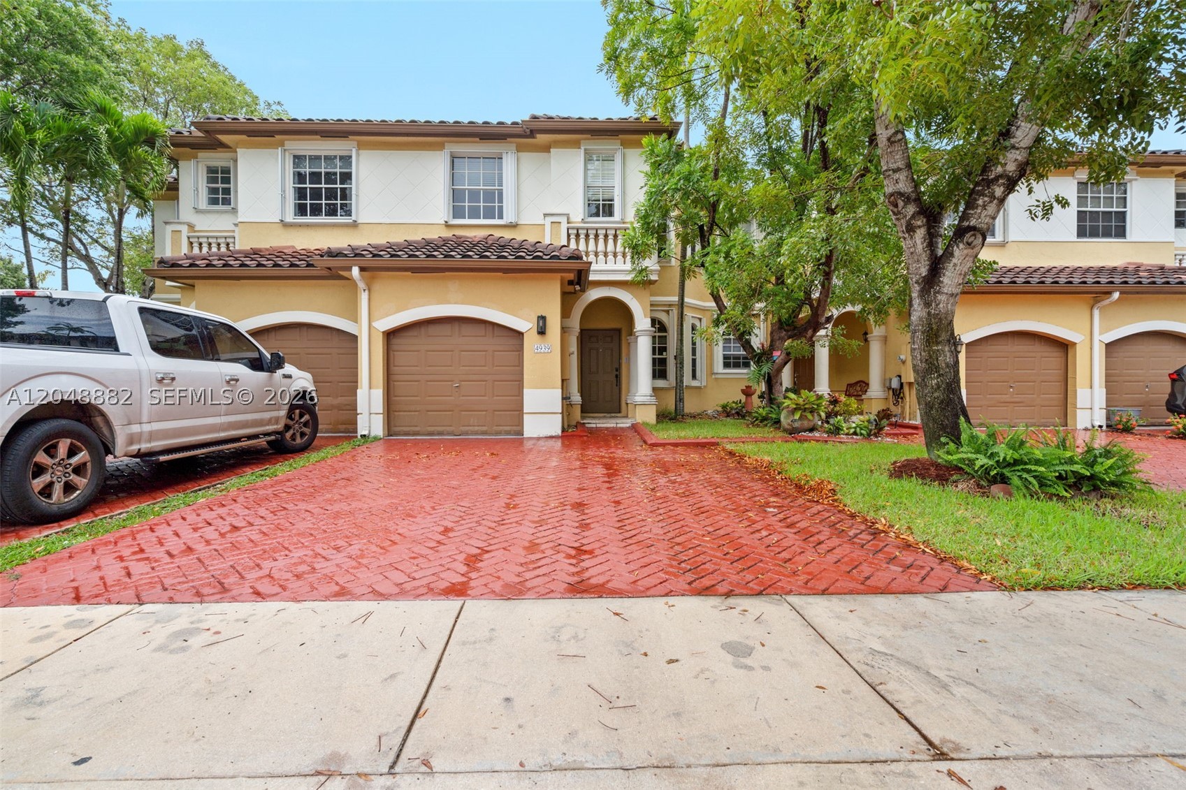 Welcome home to the ONLY available 4 bedroom townhome in the very desirable community of Santorini at Vizcaya! 
Porcelain Tile & engineered wood floors throughout. Upgraded kitchen with modern multi-tone cabinetry, stainless steel appliances & granite counters with plenty of storage & huge pantry. All bathrooms have been updated. The Large master bedroom features a separate shower, Roman tub & Walk in closet. New A/C
Enjoy your private spacious back patio & fenced yard perfect for family & entertaining. Convenient Laundry room & Accordion hurricane shutters. 1 car garage plus 2 driveway parking spaces & plenty of guest parking
Exclusive community Amenities include sparkling pool, fitness center, playground & clubhouse. HOA covers 24/7 guarded entry, lawn maintenance, and cable. Prime location in the heart of Miramar just Minutes to A+ schools, shopping, dining, major highways (I-75/FL Turnpike), and Vizcaya Park.