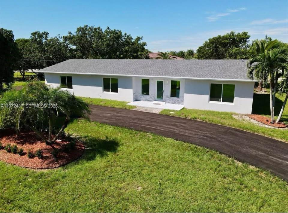 MODERN FLOORING – UPDATED WATER SYSTEM – TASTEFULLY RENOVATED BATHROOMS – NEW ROOF – BRAND NEW HVAC SYSTEM – OVERSIZED CORNER LOT – DOUBLE LOT

Single-family residence in Homestead, completely renovated and well maintained. The property is situated on an oversized corner lot with an additional adjoining lot, offering ample outdoor space and multiple potential uses.

The home features 3 bedrooms and 2 bathrooms, a covered 2-car garage, hurricane-impact doors and windows, updated plumbing, electrical system, and brand-new HVAC system. Interior highlights include modern flooring throughout, a renovated kitchen with stainless steel appliances, tastefully updated bathrooms, and washer and dryer inside the unit.

The expansive outdoor area includes mature fruit trees and a second lot that allows for additional parking, recreational space, or future outdoor enhancements. The property offers excellent natural light, privacy, and flexibility for outdoor living.