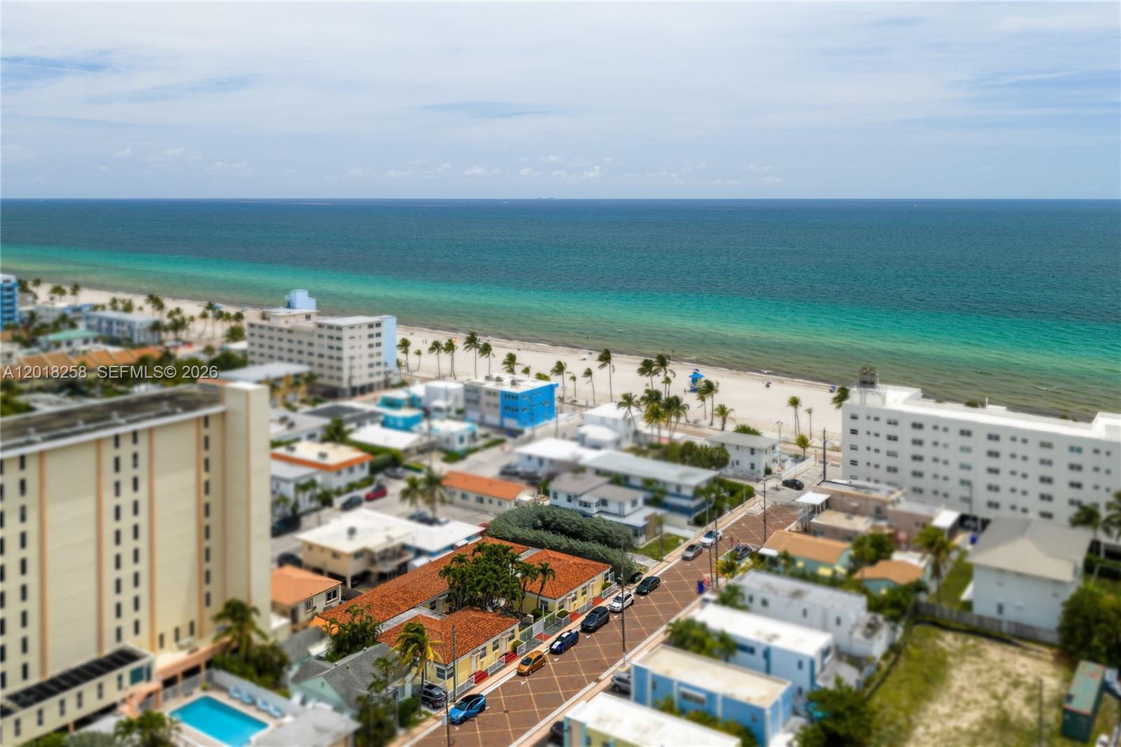 12 steps from the Atlantic. 12 income-producing units. Rarely does proximity meet opportunity like this.
This fully renovated, gated compound sits on Hollywood Beach Broadwalk — one of Travel+Leisure's Best Beach Boardwalks in America. Every unit delivers a full kitchen, split-AC system, and impact windows. Secured tropical courtyard with BBQ, on-site laundry, and 12 private parking spaces. New Spanish tile roof, updated plumbing and electrical throughout.
All leases month-to-month — flip to short-term rental from Day 1. The location speaks for itself: Margaritaville steps away, Related Group's 39-story luxury tower under construction on the same Broadwalk, and the City's planned Broadwalk extension starting at Georgia Street. Over $1.5B in active development surrounds this block.
Zoned BRT-25-R. Grandfathered 12-unit density no new build can replicate. A Live Local corridor where developers are spending $40M+ assembling comparable land.
Buy the income. Hold the land. The block is transforming.