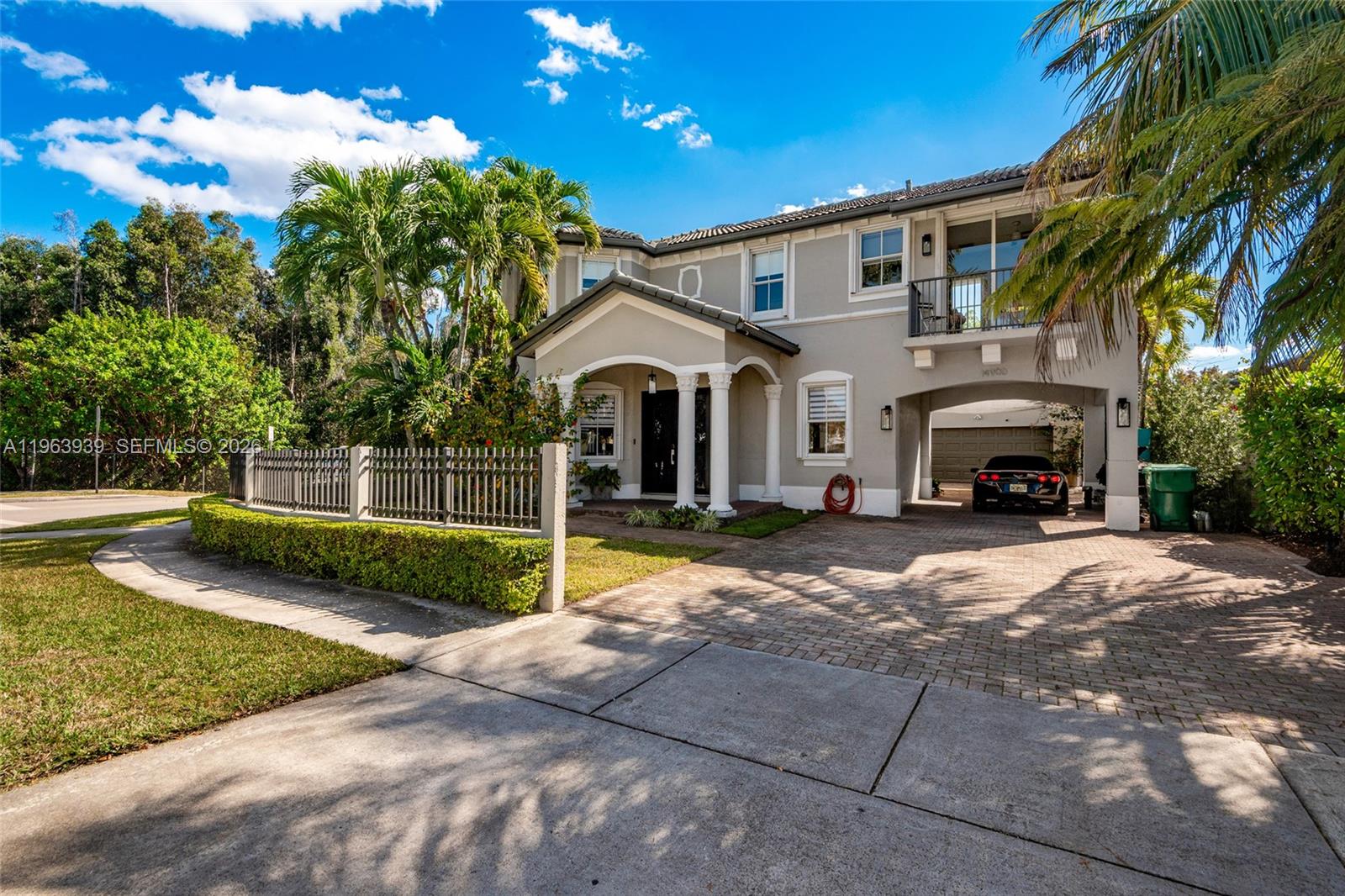 Exceptional two-story residence offering 3,470 sq ft of beautifully updated living space in a prime West Kendall location. This 5-bedroom, 3-1/2 bath home blends modern design, functional layout, and private outdoor living. Step inside to expansive open living areas featuring waterproof wood plank flooring, abundant natural light, and elegant contemporary finishes. The fully remodeled chef’s kitchen showcases sleek white cabinetry, quartz waterfall island, stainless steel appliances, designer backsplash, and generous seating — ideal for entertaining. The home offers a versatile floor plan with spacious bedrooms, updated bathrooms including a stylish modern vanity with backlit mirror, and a generous primary suite complete with sitting area and private balcony access. Outdoor living is a true highlight. The property features a covered terrace with ceiling fans, expansive deck space, and a private pool surrounded by tropical landscaping — creating a resort-style backyard perfect for entertaining or relaxing. A side garden walkway lined with palms adds privacy and charm. Features include: accordion shutters throughout, impact front door, paver driveway, dedicated laundry room, ample storage and two-car garage used as a modern private gym. Move-in ready and meticulously maintained, this home offers space, style, and privacy in one of Miami’s most desirable residential pockets near top-rated schools, shopping, and major highways. Adjacent to a protected preserve.