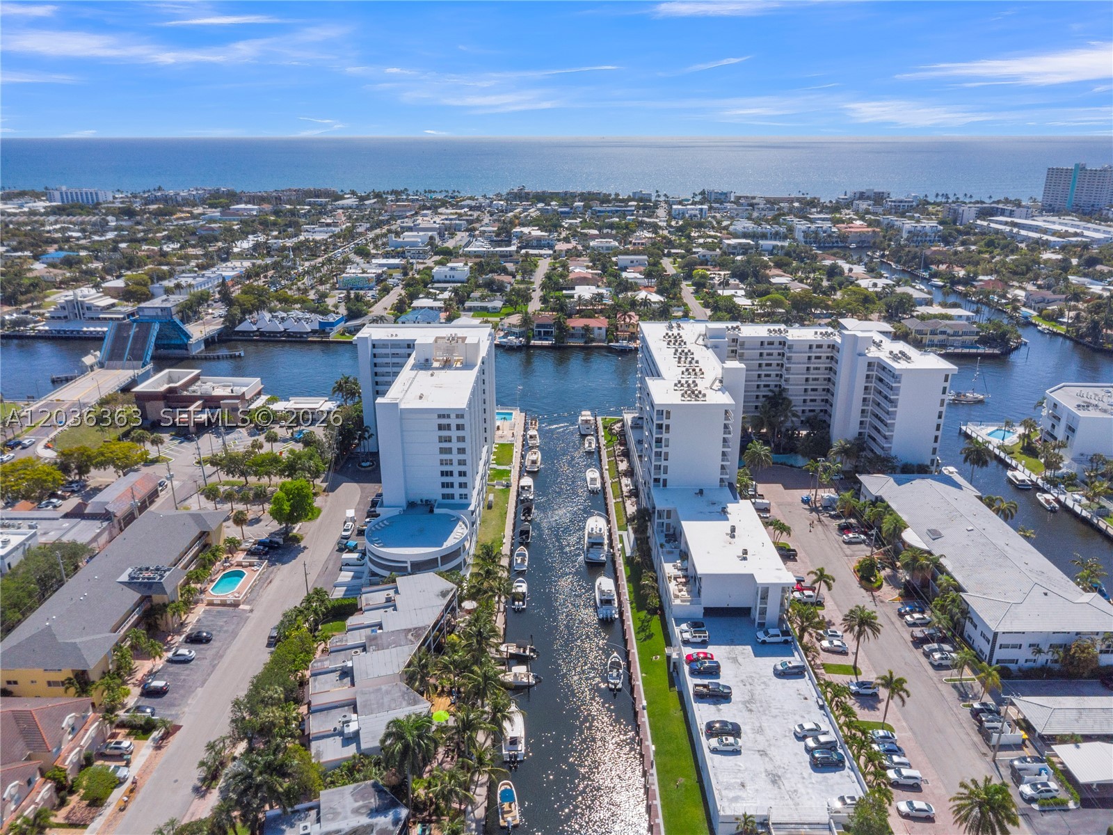 Luxury waterfront living at its finest. Dock your boat outside your apartment. Unique one of a kind,
two units combined in this spacious 3744 sq. ft. 3-bedroom, 2.5-bathroom on the intracoastal and canal with a huge balcony approx. 36 ft. X 15 ft. Living room, dining room and den surrounded by sliding glass doors leading onto the balcony. Great for entertaining while enjoying the coastal water views as boats pass by your apartment. Living room approx. 36 ft. x 20 ft., dining room and den approx. 32 ft. x 12 ft. Master bedroom has a separate balcony over looking the intracoastal. Unusually large walk-in shower. Lots of closet space. Lots of natural light fills the apartment. Additional highlight includes highly sought-after two parking spaces inside the garage conveniently located near the elevator. The Pilot House waterfront community in Coral Ridge Country Club Estates offers lobby security, fitness center, heated pool, barbeque area with outdoor dining, community lounge, pet friendly building, cable TV & WiFi. Boat slip and jet ski docks for rent when available. Ideally located just minutes from Lauderdale by The Sea, the beach, shops and local restaurants. Experience resort living on the water.
