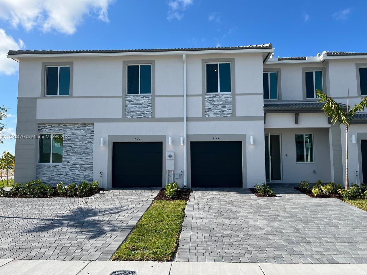 NEW! NEW! NEW! Discover your new home in the exclusive Lennar TERRA SOL community in Homestead! This brand-new townhome features a spacious living room, a modern kitchen with an island and stainless steel appliances, and a half bath on the ground floor. Enjoy a large grassy patio and a covered garage. The second floor boasts three spacious carpeted bedrooms, a balcony, and three full bathrooms. Ideally located near schools, the beautiful Florida Keys beaches, shopping centers, and plazas. Don't miss this unique opportunity! COMMUNITY UNDER CONSTRUCTION!
