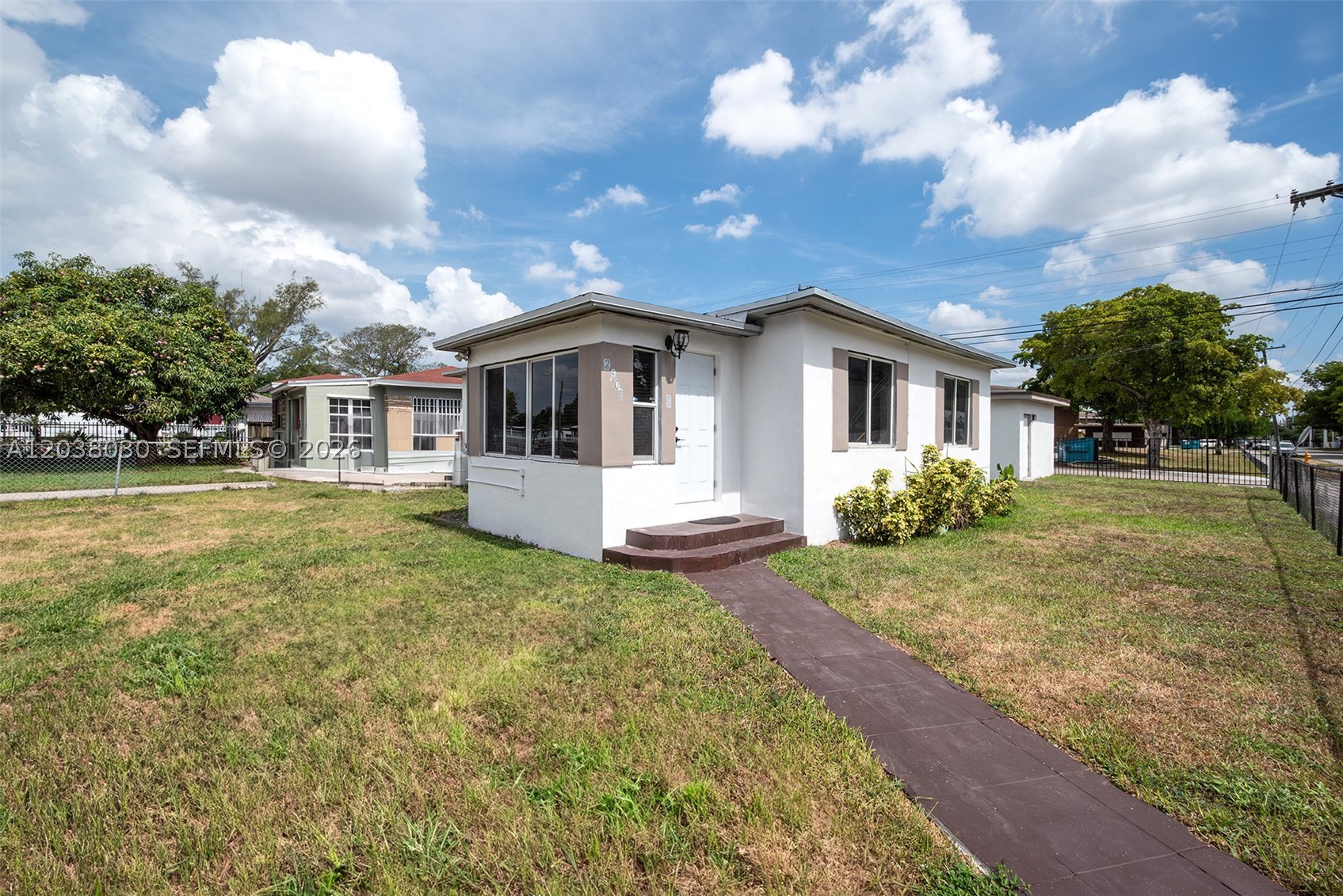 Renovations happening now! This corner-lot featuring a 2-bedroom, 1-bath single-family home with a detached 1-bedroom, 1-bath in-law quarters. This move-in-ready home offers tile flooring throughout, new appliances, washer and dryer, central A/C, and a brand-new roof. The detached in-law quarters features impact windows, providing comfort and peace of mind. Situated on a desirable corner lot, this property offers versatility for extended family, guests, or potential rental income. Don't miss this incredible opportunity to own a beautifully updated property. Come make this your dream home!