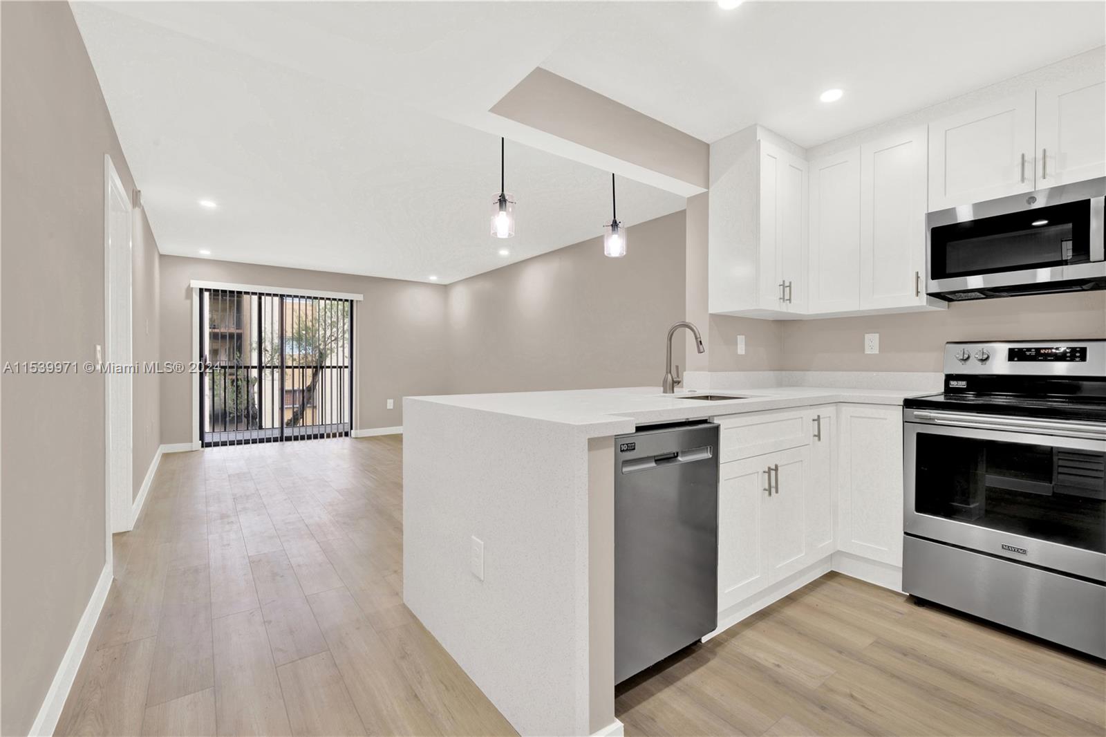 Gorgeously renovated 1 bed, 1 bath unit showcasing exquisite details throughout. Revel in the new quartz countertops, freshly painted walls, and sophisticated touches in the bathroom. Luxurious laminate flooring adds to the charm, while the convenience of a new washer and dryer within the unit enhances daily living. The eat-in kitchen features inviting countertops perfect for stools. Additionally, residents enjoy access to community amenities including 2 sparkling pools and tennis courts. The unit accommodates a maximum of 2 people, with no pets allowed. Enjoy the convenience of 1 assigned parking spot and guest parking. Renters insurance is mandatory for this upscale rental opportunity.
