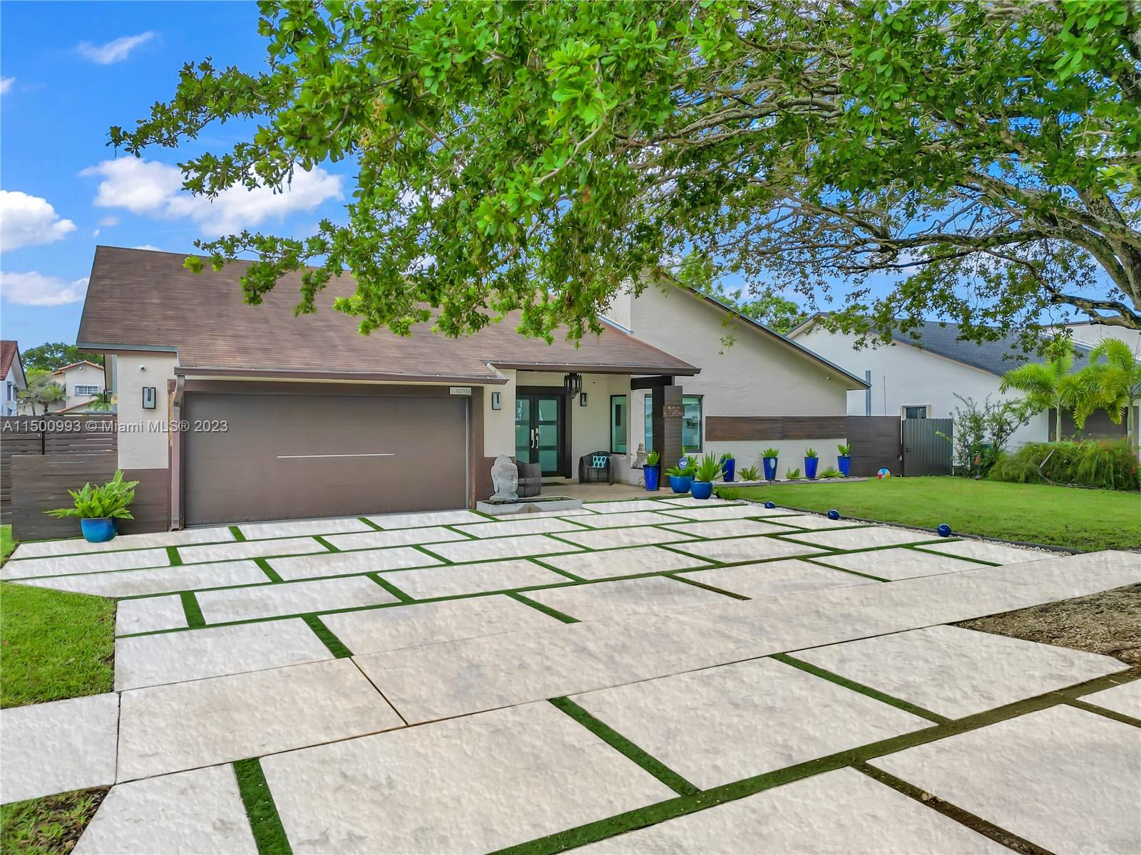 Come live in this breath taking beautiful home with all the luxuries you can dream of. This lovely home has tiled wood floors throughout with updated brand new bathrooms and kitchen as well as newest technology. Home comes equipped with 12 surveillance cameras, fully purified water throughout the house, impact windows and doors throughout, new roof, fenced in back yard, breathtaking new pool with waterfall and many more amenities throughout the home. This fully updated paradise will not last and is available mid Home is conveniently located close to great schools near, fine dining, restaurants and much more. HOME COMES FULLY FURNISHED.