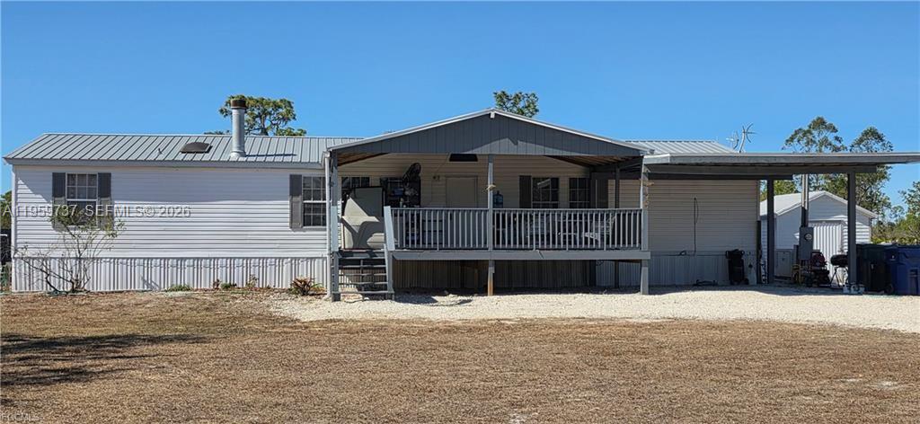 Well-maintained manufactured home on 1 acre featuring 3 bedrooms and 3 full bathrooms. Interior highlights include new carpet in the living room and bedrooms, split bedroom layout, and ample natural light. Exterior features include an oversized front deck, handicapped ramp, whole-house generator, fenced yard, and pond. Property offers three storage buildings for additional storage or workspace. Quiet setting with room to enjoy the outdoors.