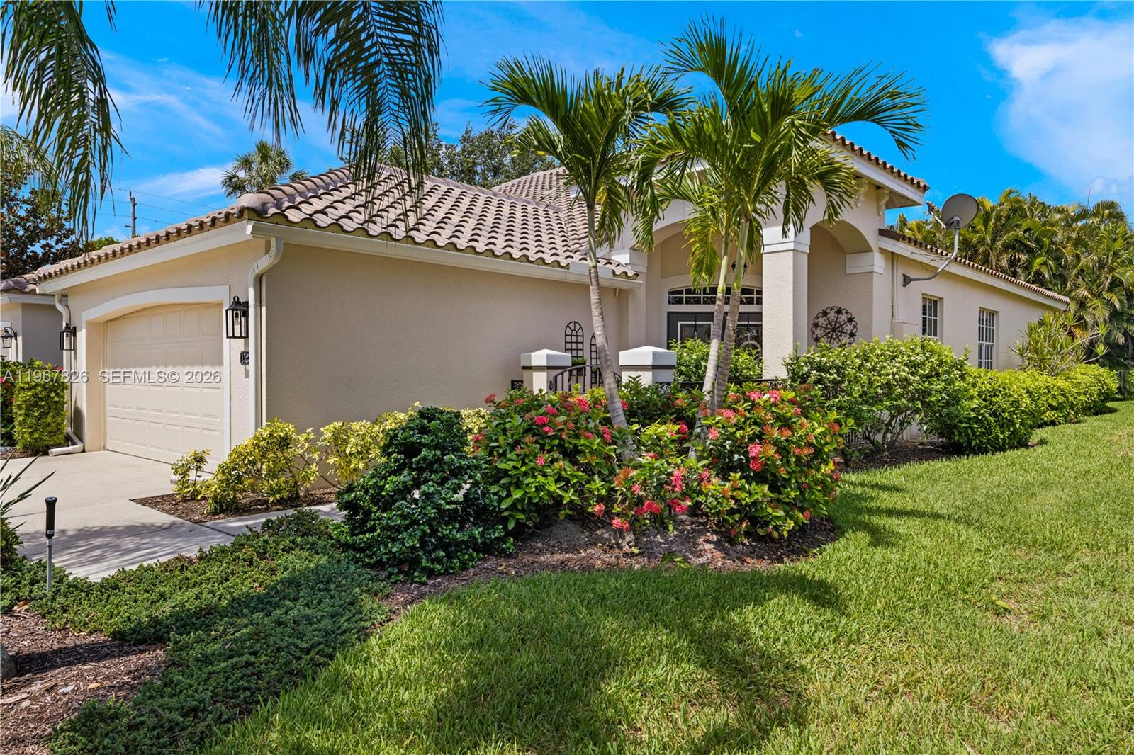 Welcome to an exceptional coastal boating community along the Caloosahatchee River with direct Gulf access, where waterfront living blends effortlessly with everyday comfort. This beautiful 3 bedroom, 2 bath home features a charming covered front patio, perfect for enjoying Florida mornings and the peaceful surroundings of the community. Inside, double entry doors open to a grand foyer with soaring 14 foot ceilings and sun filled spaces that create a light, airy coastal feel. The open concept design is ideal for entertaining, highlighted by an updated kitchen with 42 inch cabinets, stainless steel appliances, and a beadboard island that flows into a shiplap accented dining area. The primary suite offers a peaceful retreat with a bamboo wood tray ceiling, spa inspired bath with granite countertops, and a spacious walk in closet. Step outside to an enclosed brick paver lanai that extends to an additional patio, forming a private tropical oasis surrounded by lush greenery. A dedicated laundry room and 2 car garage with epoxy flooring add everyday convenience. Residents enjoy resort style amenities including two pools, tennis and pickleball courts, a covered riverside pavilion and park for monthly gatherings, a private beach, and a 600 foot pier planned for replacement in 2026. This exceptional home delivers coastal charm, boating access, and an active waterfront lifestyle in one inviting package.