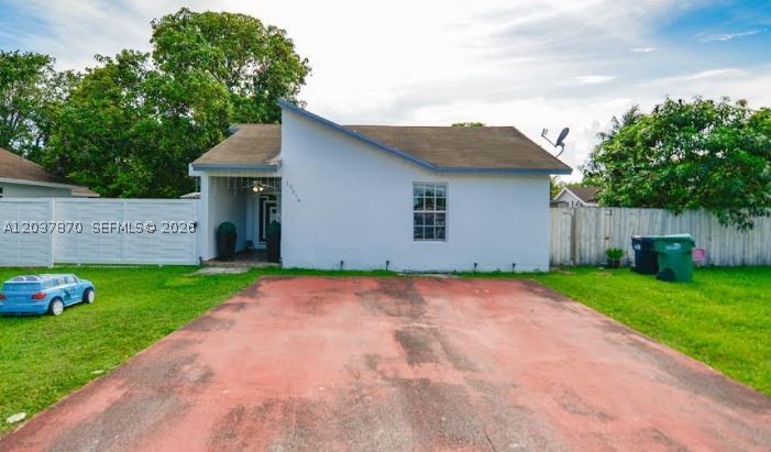 This 3-bedroom, 2-bathroom single-family home at 15216 SW 112th Pl, Miami, FL 33157 offers a bright, open 1,112-square-foot interior with spacious bedrooms and excellent closet storage. Nestled on an expansive 6,600 sq. ft. lot in the Palmetto Estates area, the massive backyard provides the ultimate blank canvas with plenty of room to add a pool, deck, tiki hut, or park your boat and RV. Its prime location grants seamless access to major highways, premier shopping, local golf courses, and essential amenities like Bravo Supermarkets. Ideal for families, first-time buyers, or savvy investors looking for incredible outdoor potential, this versatile Miami property is a must-see.