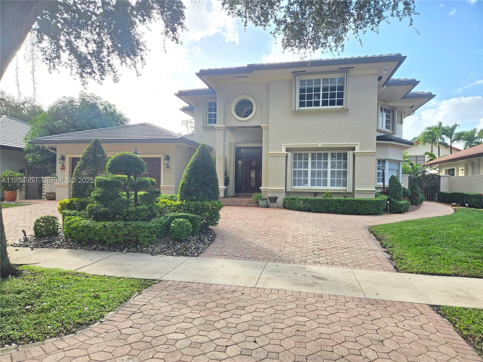 Welcome to your DREAM HOME in the prestigious Royal Oaks Community in Miami Lakes. A gated enclave known for its tree lined streets, grand homes and premier location. This stunning 5 Bed 3 1/2 bath home is the perfect blend of sophisticated design & premium finishes. Expansive open floor plan w/ vaulted ceilings and natural light, Elegant formal living and dining spaces with architectural detailing. Chef’s kitchen w/top-of-the-line appliances, custom cabinetry & large center island. Oversized master retreat with Spa bath featuring 2 vanities, roman tub, glass-enclosed shower, and premium finishes. Large family room flowing seamlessly into Outside pool & spa Oasis w/built in Gazebo that are the perfect environment for entertaining with lush landscaping and peaceful tranquility. Excited to show you your dream home!
