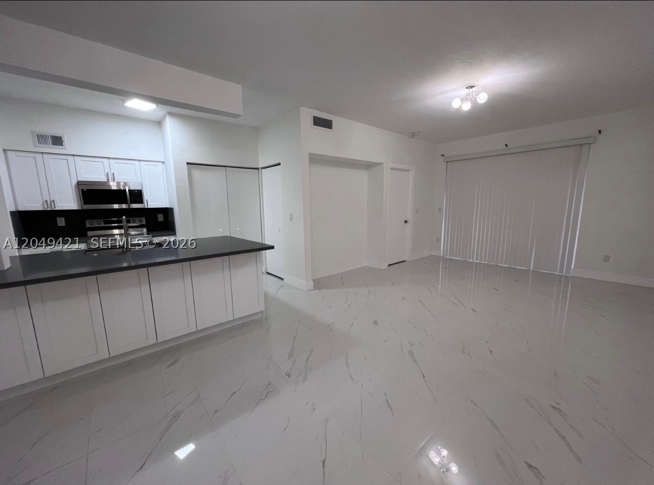 Welcome to La Hacienda! This spacious 2-bedroom, 2-bath condominium offers 1,077 square feet of comfortable living space in the heart of Hialeah. The well-designed floor plan features a bright living and dining area, generously sized bedrooms, ample closet space, and a private primary suite with its own full bathroom. The functional kitchen provides plenty of cabinet storage and opens to the main living area, creating a welcoming space for everyday living and entertaining. Enjoy the convenience of living in the desirable La Hacienda community, ideally located near shopping, dining, schools, parks, major highways, and public transportation. this condo offers comfort, convenience, and an excellent location. (Gated community, pool, clubhouse, balcony, washer/dryer, assigned parking. A fantastic opportunity for anyone seeking a comfortable home in a convenient location.