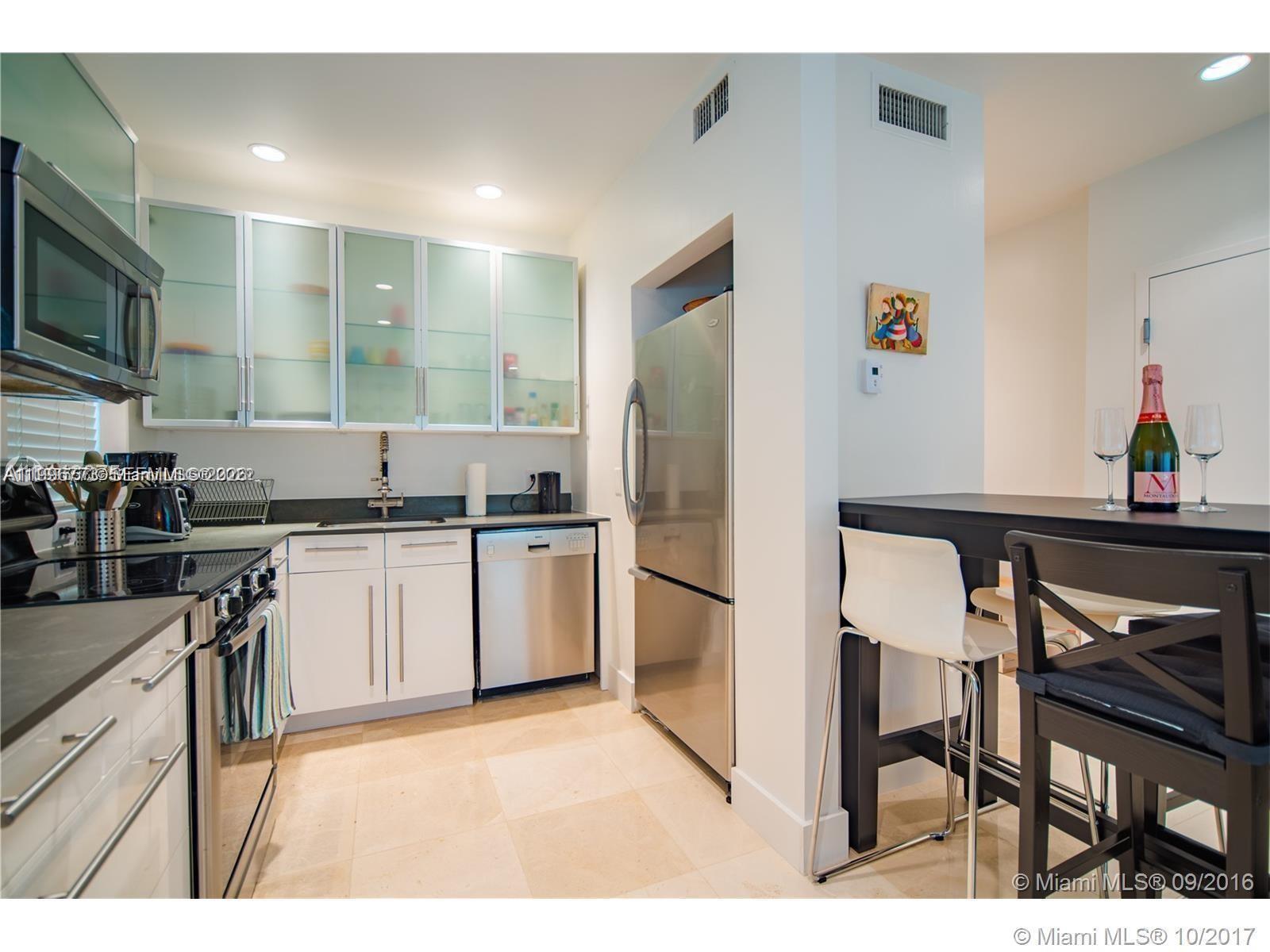 Filled with natural light, this 1st-floor corner unit features multiple windows in the living room and kitchen. The spacious layout includes an open, upgraded kitchen with quartz counters and custom cabinetry. Highlights include hardwood floors throughout, high ceilings, a large bedroom, an in-unit washer/dryer, central A/C, and high-end finishes. Boutique building with only 8 units, fully updated with impact windows, newer electrical, and plumbing. Prime location just steps from Flamingo Park, Espanola Way, Lincoln Rd, shops, and restaurants. Please note that this property is available for purchase by cash buyers only. Tenant occupied until 7/31/26, paying $2,200/month.