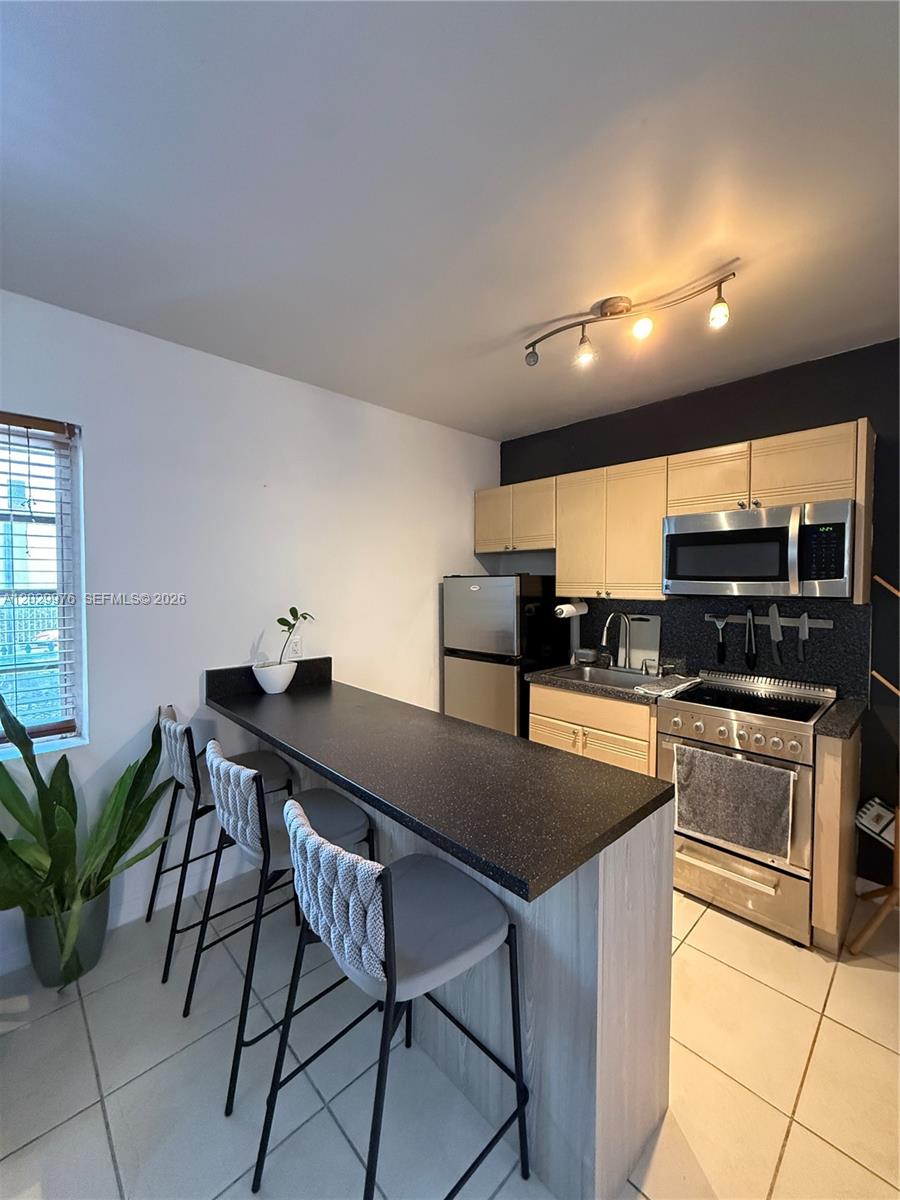 Furnished apartment with central A/C, an in-unit washer and dryer, and an assigned parking space - a rare combination in the heart of South Beach. Located in a charming Art Deco building just one block from Target, Publix, Walgreens, and the 5th & Alton shopping center, also minutes from the beach and Flamingo Park. Features stainless steel appliances, including an oven and microwave, with water included in the rent. This apartment offers the perfect blend of Miami Beach charm, modern comfort, and an great location.