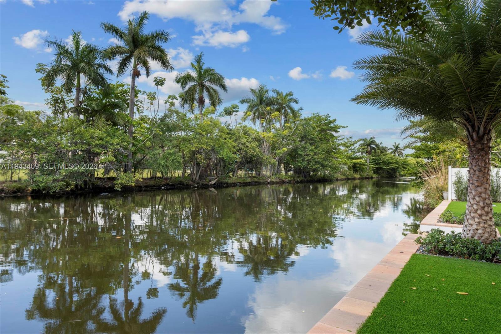 Elegant Riverfront Oasis, meticulously detailed redesigned 3-bed/2.5-bath, plus separated space for possible in-law suite with water view.  Grand open living area with lighting enhancements, New gleaming porcelain flooring. Bright waterfall styled kitchen island, sleek state of the art stainless steel appliances. Residence spans 2,544 total square feet, including versatile 2-car garage featuring kitchenette, A/C & water closet.  New Cat 5 metal roof, impact windows & doors for peace of mind, The property also boasts elegant waterfront yard lighting & new irrigation system. Abundant parking, with circular driveway connecting to side & rear driveways, space for boat/RV.  So much more to mention! Schedule your private viewing today and prepare to be captivated by this extraordinary offering.