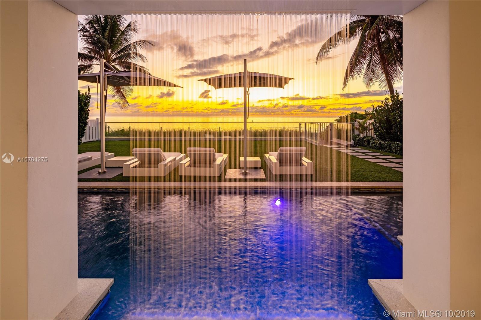 Malibu Modern architecture meets the incredible oceanfront of Fort Lauderdale beach. The rare combination of toes in the sand, high ceilings, natural light, with the perfect sway of indoor and outdoor living makes this the perfect place to call home. Wake up with the sunrise as you walk directly into the ocean for a rejuvenating morning ritual. Meditate poolside with the sounds of your waterfall blurring out the noises of everyday life. Cheers to the your family and friends on top of your private rooftop deck as you watch the sunset and look forward to another beautiful day of harmony on the ocean. Featuring 5 bedrooms and over 6,400 square feet of living space with top-of-the-line finishes. This Utopian beachfront retreat is calling you home.