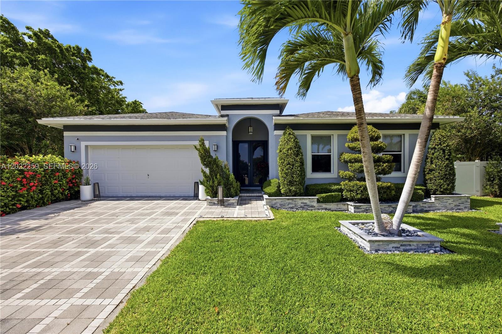 Fully renovated 3BR-2BA pool home with a 2-car garage, built on an oversized 10,000 sq. ft. lot. Step inside to an expansive open-concept layout featuring elegant porcelain flooring, two custom entertainment bars, a dining-welcoming room, and a gourmet chef’s kitchen with marble countertops and designer finishes. The spacious primary suite offers a spa-inspired oversized shower and a private stackable washer-dryer in the custom closet. An extra room provides the ideal space for a home office, gallery, or guest retreat. Every room showcases unique touches and curated décor and lighting fixtures throughout. An additional full-size washer and dryer is available inside for extra use. Furniture is For Sale!
The outdoors was designed to embrace the resort-style living, featuring a spectacular private backyard enclosed for privacy and tranquility. The covered patio lounge is equipped with high fans, marble countertops, a beverage refrigerator, and the option to close the shutter for more privacy.  Enjoy the in-ground pool, dedicated future spa space, outdoor dining, and grilling area — all for your enjoyment under the South Florida sun.
Recent upgrades include a kitchen (2025), AC system (2024), landscaping (2024), and fresh interior/exterior paint (2023). Conveniently located on Andrews Avenue and Oakland Park Blvd near shopping and dining