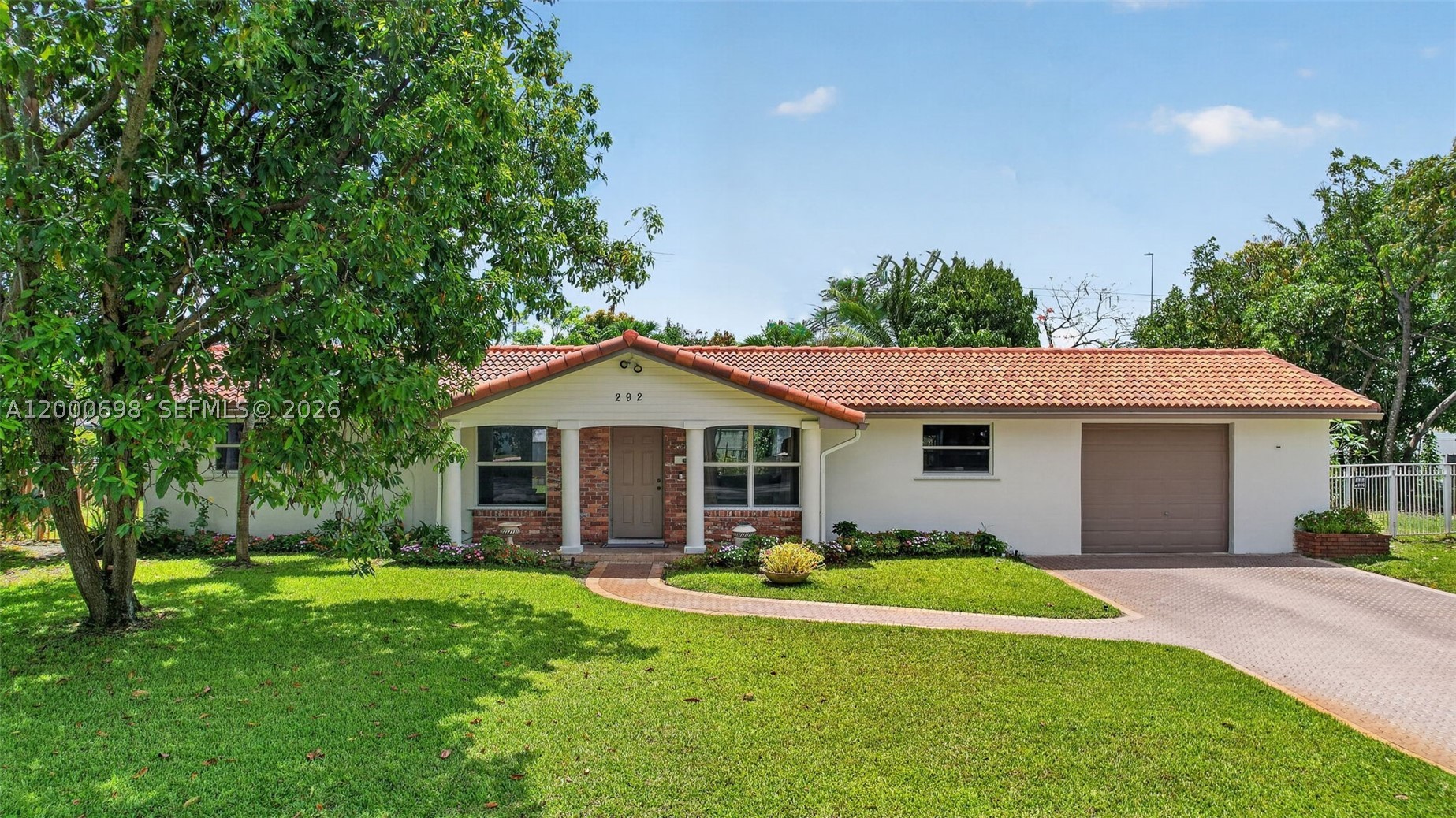 Welcome to this move in ready 3 bedroom, 2 bath, 1 car garage home nestled on an expansive 14,610 sq ft lot in the highly desirable, tree-lined community of Plantation Park with NO HOA and just a short walk to Heritage Park! Perfect for entertaining, this property features a sparkling pool and a spacious, fully fenced backyard with a variety of fruit trees such as mango, avocado, coconut trees & more. Inside, enjoy an open and inviting layout with a modern kitchen showcasing sleek stone countertops and stainless steel appliances. Each bedroom offers generous space and walk-in closets. Additional highlights include freshly painted interior and exterior, updated bathrooms, partial impact windows with hurricane panels for added protection, A/C ducts replaced in 2023, water heater (2019), and a new main electrical panel (2025). A true turnkey opportunity, ready for its next owner to move right in!