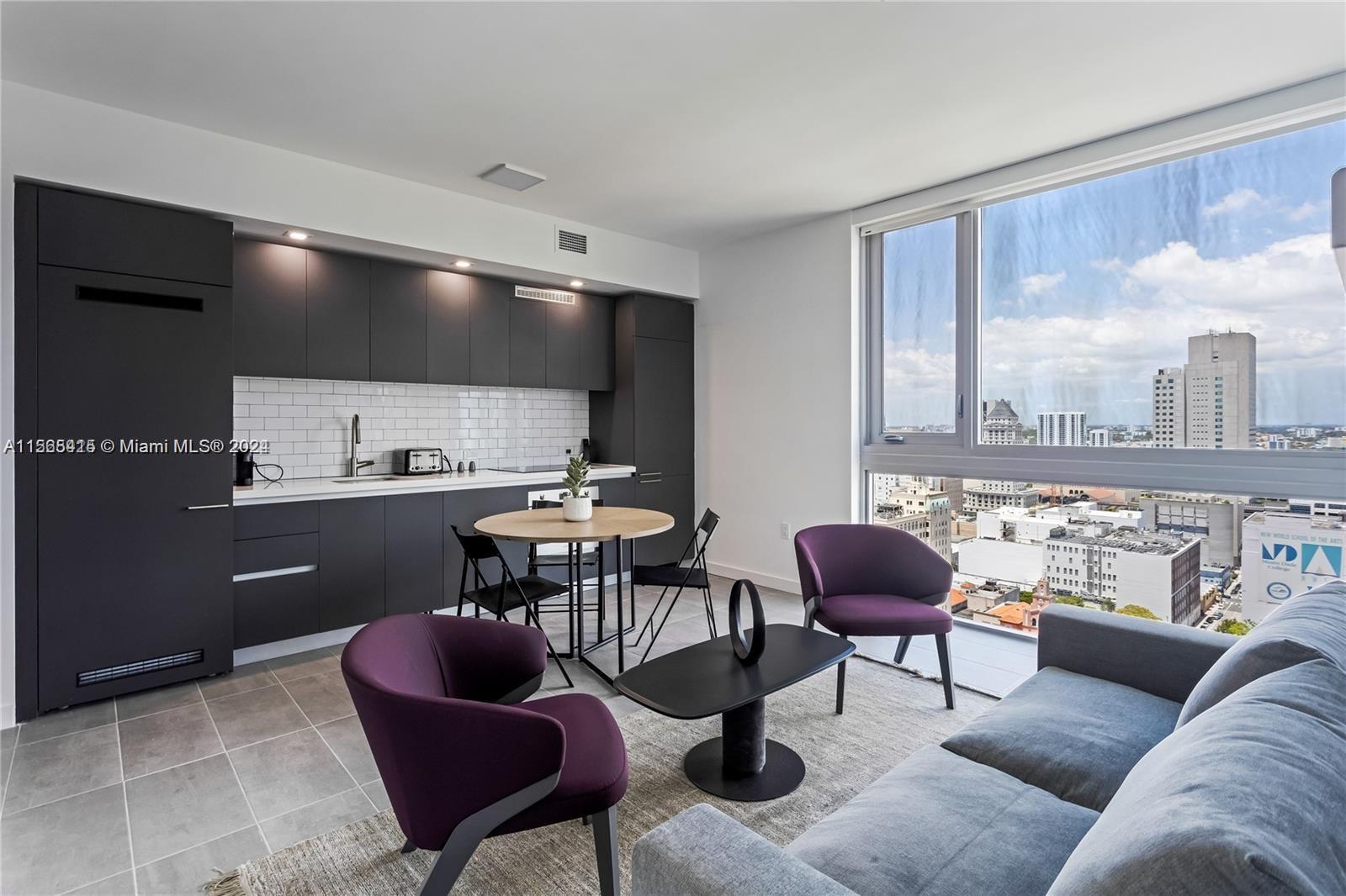 Fully furnished and equipped designed 2 Bedroom 1.5 Bath Corner unit On the top of the 28th floor with bay views and city.
Profitable investment, ideal for generating cash flow with the convenience of daily rentals This turn key Pad comes equipped with italian furniture, a convertible murphy bed in the living room, a walk-in closet, full-size washer and dryer!
Located in new modern Yotel pad in Downtown Miami with easy access to Museum Park and the Arts District, as well as the Wynwood and the Design District, the neighborhood is ideal for walkers who want to have easy access a variety of nearby restaurants, nightspots, and cultural facilities to choose from. This brand new building features stunning amenities including a gym with peloton bikes, restaurant/bar, pool d a co-working space.