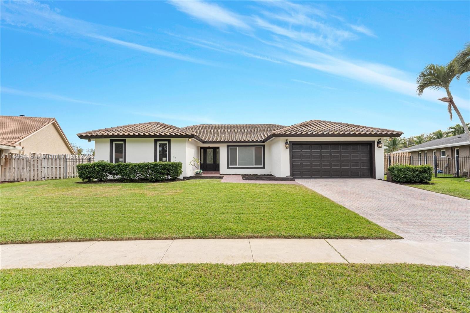 Welcome to this stunningly remodeled home in the serene Jacaranda Lakes community. Experience the essence of luxury in this exquisite 3 bed, 2 bath residence, boasting a spacious 2-car garage. Revel in the modern elegance of anupdated roof, windows, and flooring that complements the stylishly redesigned kitchen and bathrooms. Every inch of this home has been meticulously updated, offering an experience akin to a new build. Indulge in comfort and sophistication in a sought-after neighborhood. Buyer can choose from the backsplash selection or provide their own. Buyer can choose the color of the backyard patio. Full price offers include more bonuses likes a custom outdoor kitchen and interest rate buy down for the buyer!! Owner willing to modify more at full price.  Don't miss this gem!
