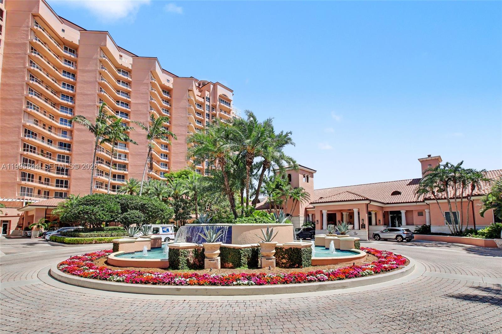 This exceptional corner residence at The Gables Club is located in the newest building and features an oversized terrace with desirable north and east exposures, filling the home with natural light.
A private elevator opens directly into your foyer, leading to beautifully appointed interiors with marble flooring throughout the main living areas. Just steps inside, you’ll find the expansive primary suite, complete with a generous walk-in closet and a luxurious spa-like bathroom featuring three sinks, dual private water closets, abundant natural light, a large walk-in shower, and a jacuzzi-style soaking tub.

This residence offers a rare and highly sought-after split-bedroom floor plan, with the guest suite privately situated on the opposite end of the unit. The spacious layout also includes a versatile private den adjacent to the eat-in kitchen—ideal for a home office or additional living space.
Impact glass windows and doors are installed throughout the unit.

Enjoy resort-style living at The Gables Club, where residents experience unparalleled service and amenities, including 24-hour security, concierge, and valet. The clubhouse offers a state-of-the-art fitness center, heated pools (including a family pool and lap pool), a full-service spa and beauty salon, private event spaces, a newly updated restaurant with indoor and outdoor dining, tennis courts, and a putting green.
This residence also includes two storage units and two assigned parking spaces.