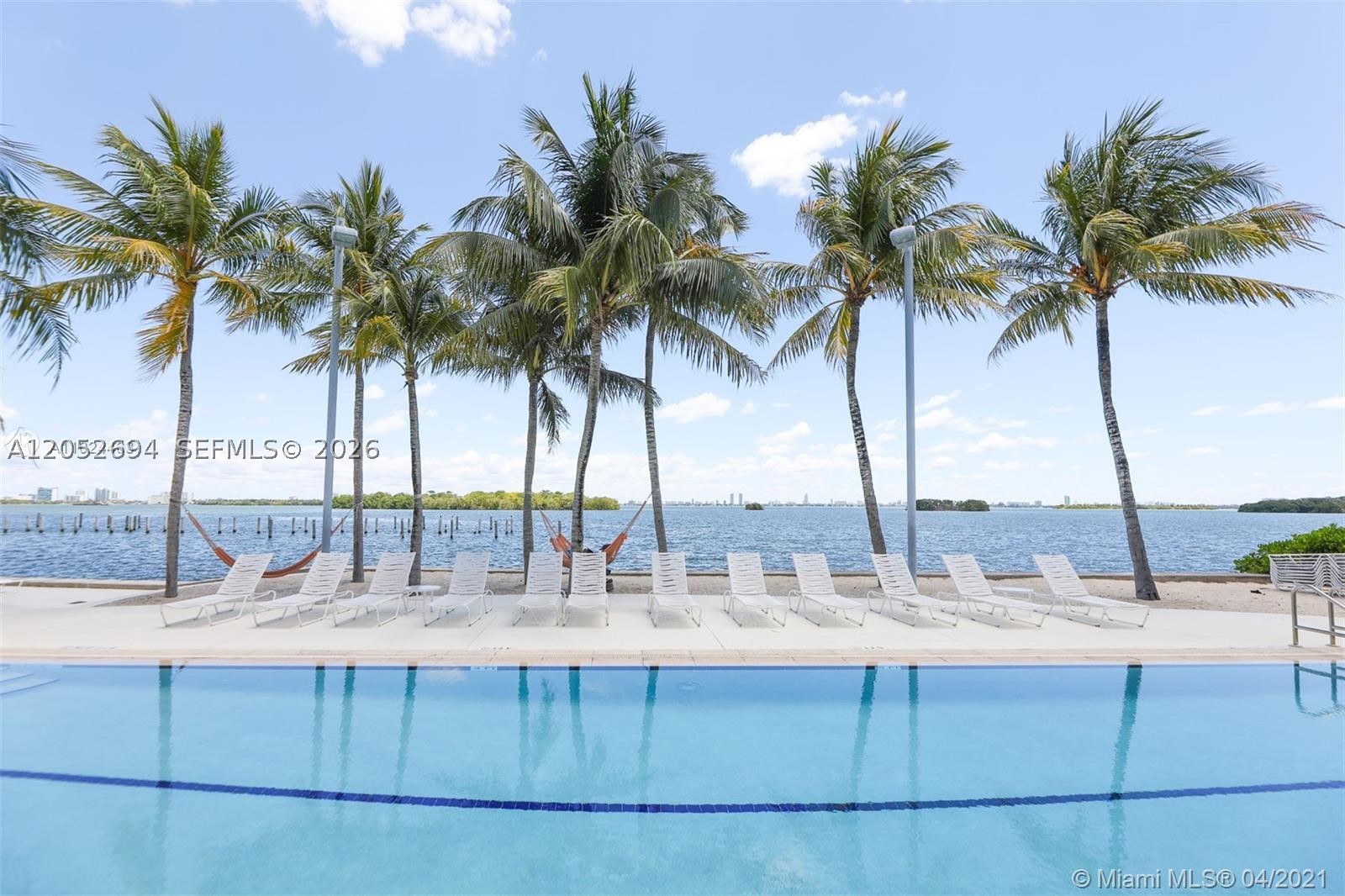 Enjoy resort-style living at Nirvana, a waterfront gated community nestled between two beautiful parks in Miami's trendy Upper Eastside neighborhood. This nicely updated 2/1 apartment filled with natural light and comfortable living space. Relax by two bayfront pools and jacuzzi surrounded by swaying palm trees, or launch your paddleboard or kayak from the community's sandy beach and explore the nearby islands. Community offers lush tropical gardens, a fitness center, steam room, 24-hour guard-gated security, and an on-site mini-market. Ideally located just minutes from the Design District, Midtown, Wynwood, Brickell, Downtown Miami, the beaches, and Miami International Airport. Available partially furnished if preferred.