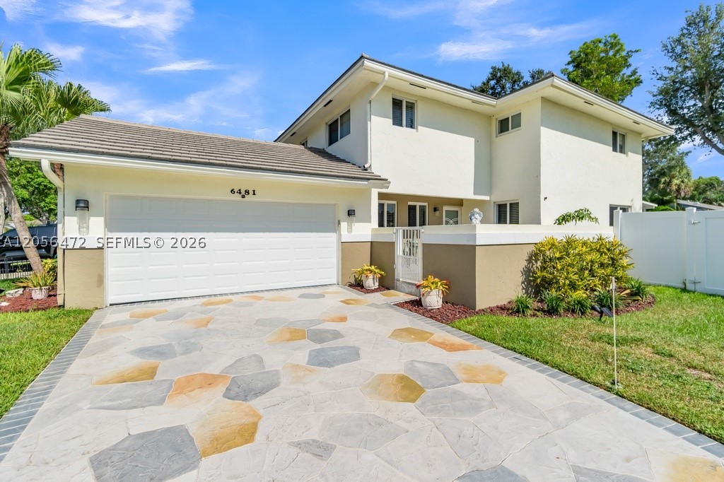 BEAUTIFULLY UPDATED FROM HEAD TO TOE in the heart of Plantation! This move-in-ready 3-bedroom, 2.5 bath, oversized 2-car garage residence offers an ideal 2-story floor plan with luxury vinyl flooring throughout, a modern kitchen featuring quartz countertops, white cabinetry w/ built-ins, subway tile backsplash, & a spacious peninsula. Enjoy the versatility of a home office or bedroom, generous primary suite, & a private fenced courtyard with covered patio perfect for relaxing or entertaining. HOME HIGHLIGHTS INCLUDE: ENTIRE HOME REMODEL 2021, NEW 2026 HVAC, COMPLETE IMPACT WINDOWS & DOORS, HOME WATER SOFTENER SYSTEM, & 2021 TANKLESS WATER HEATER. Very low HOA & NON-FLOOD ZONE. Conveniently located near top-rated schools, parks, shopping, dining, & major highways. MUST SEE TO TRULY APPRECIATE!