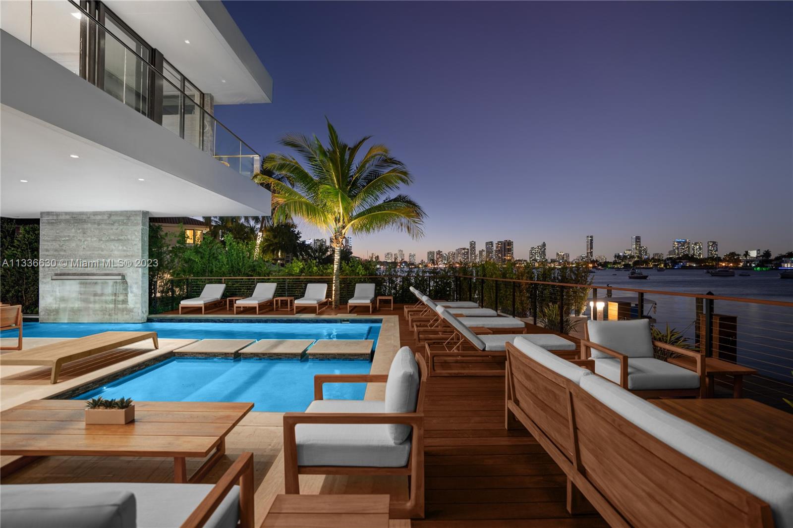 Stunning tropical modern home with westerly sunset views located on prestigious Hibiscus Island with 24/7 police guarded gated entrance. Wide bay Biscayne views upon entry to this luxury home, masterfully designed in 2017 by award-winning architect Choeff Levy Fischman. Indoor/outdoor living on ground floor is perfect for entertaining with its open dining and family areas, with five bedrooms and office area, spacious master bedroom with dramatic water views. Featuring custom Italian kitchen, oak wood floors, Crestron smart home system, floor to ceiling windows and a two car garage. New Ipe rear deck decking with expansive relaxing outdoor area, and lush landscaping provides resort style oasis rear yard including a salt water pool and spa, and private dock.