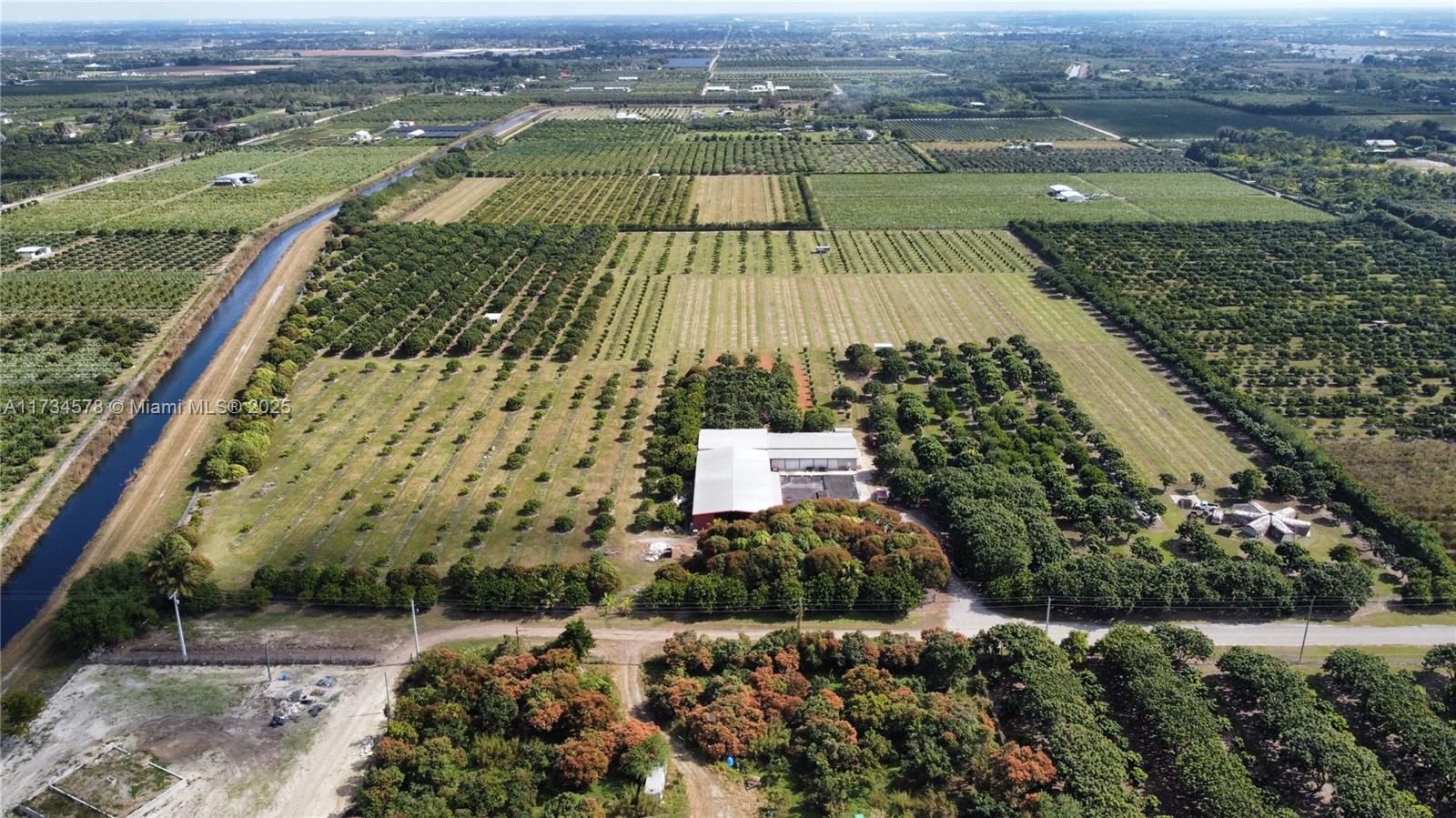 Own a piece of history with this amazing opportunity to own one of the first Longan groves in the Redland area. 31+ acres of income producing farm operation in place for many years. The grove features 1060 Longan trees, 1250 White Guava trees, 1220 Red Guava trees, 325 Sweetheart Lychee trees, 95 Thai Mango trees and 290 Wampee trees. There is a variety of mature trees as well as a third of the property recently replanted. The property has a 10,000 sq ft warehouse w/ loading dock and 2 large walk-in coolers. Fully irrigated with 3 Diesel pumps, fully fenced & gated w/ 16 camera security system. Bonus of two abandoned properties onsite that could be easily renovated for workers living quarters or rental income. 2 separate folios #30-7809-000-0241 and #30-7809-000-0231