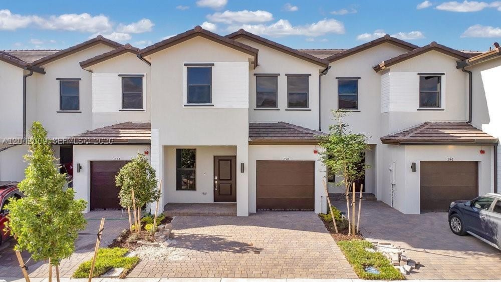 Stunning, like-new 2023 construction townhome in the highly sought-after, gated community of Sunset Pines! This pristine corner unit features a spacious 3-bedroom, 2.5-bathroom layout packed with modern upgrades, including custom zebra blinds throughout. The sleek gourmet kitchen boasts premium quartz countertops and stainless steel appliances. Enjoy the ultimate convenience of an in-unit washer/dryer and a 1-car garage. Perfectly situated at the corner of Dykes Rd & Pines Blvd with rapid I-75 access. Walk to the vibrant new shopping center or take a short drive to Pembroke Gardens and Pembroke Lakes Malls. Low-maintenance resort living in the heart of Pembroke Pines. Move-in ready for 2026!