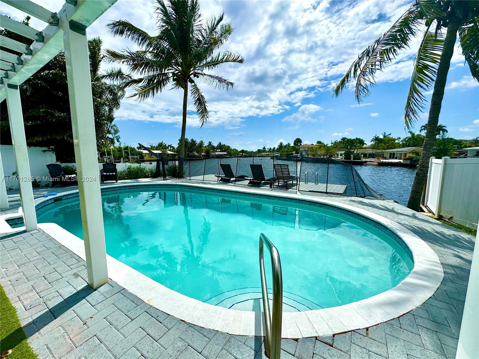 This charming 2-bedroom, 2 bathroom villa for rent in Wilton Manors has been beautifully updated to offer a cozy yet modern coastal retreat lifestyle. The home features a bright and airy open living space with an intimate dining area and fully-equipped kitchen, perfect for preparing meals in a relaxed setting. The bedrooms are spacious and thoughtfully designed, providing comfort and privacy. Step outside to enjoy your own private oasis with a sparkling pool, where you can unwind while taking in the stunning water views, or enjoy using the dedicated BBQ area ideal for al fresco dining and entertaining. Located in the heart of Wilton Manors, you'll be just minutes from the beach, local dining, and vibrant nightlife. This is the perfect place to enjoy South Florida living at its best!