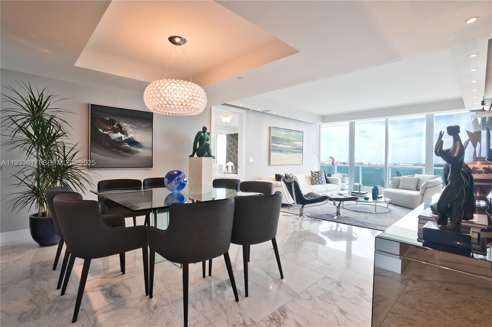 Experience Elevated Waterfront Living at Jade Brickell- Welcome to Residence 1609, where refined design meets the vibrant energy of Miami’s most coveted waterfront neighborhood. This two-bedroom + den residence with three full baths offers an exceptional blend of sophistication, space, and privacy- complete with a private elevator entry that opens directly into the home. Bathed in natural light, the expansive living areas are enhanced by Calacatta marble floors, recessed lighting, and surround sound system, creating a refined yet inviting atmosphere ideal for both entertaining and everyday living. The sleek kitchen is appointed with top-of-the-line Miele appliances and custom Italian cabinetry. The thoughtfully designed split floor plan provides comfort and privacy, while the versatile den offers flexibility as a home office, media room, or guest space. Designer upgrades throughout elevate the residence with timeless finishes and meticulous attention to detail. The primary bath features dual sinks, updated cabinetry, jacuzzi soaking tub, separate shower and a toilette closet. Jade at Brickell Bay Dr is a full-service, luxury waterfront condominium celebrated for its striking architecture and resort-style amenities, including a bay front pool, state-of-the-art fitness center, spa services, 24-hour concierge, and valet parking. Ideally located just moments from Brickell City Centre, world-class dining, and Miami’s financial and cultural hubs. Live where the bay meets the city!
