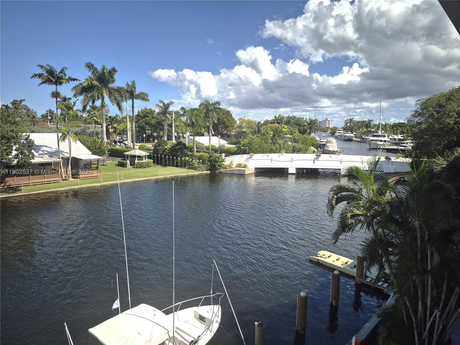 This turnkey fully furnished waterfront condominium offers an ideal urban retreat or winter residence, featuring 2 bedroom convertible (second bedroom presently used as a den/office, bedroom/guest room) and 1.5 baths. The designer-updated kitchen is equipped with quartz countertops and stainless-steel appliances. Bathrooms are appointed with high-end finishes, reflecting quality craftsmanship throughout. Residents can enjoy direct water views, tile flooring, plantation shutters, as well as high-impact doors and windows. Situated in the Las Olas Isles, the property provides convenient access to the beach, premier shopping, and dining establishments, all within walking or biking distance.   Building includes land lease, fee included in monthly maintenance.  Docks can be rented from other owners.