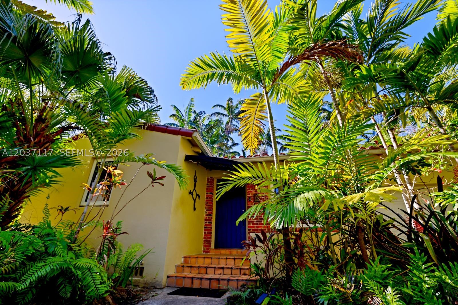 Beautifully updated Upper East Side single-family home in the highly desirable 33138 corridor, just minutes from Miami Shores, Biscayne Park, and the Design District. This move-in ready property blends modern upgrades with timeless charm, featuring bright, airy living spaces filled with natural light, impact windows, and a thoughtfully renovated interior. Rare for the area, the home includes a one-car garage plus additional parking. The home offers a spacious living area, updated kitchen, and well-proportioned bedrooms designed for comfortable everyday living. A standout Florida room with vaulted wood ceilings and French doors opens to the backyard, creating a bright indoor-outdoor living space that adds both character and flexibility. This room can easily be converted into a home office, nursery, gym, or flex room to suit your needs. Situated on a quiet residential street just minutes from everything, the home offers both privacy and convenience. The lush, fenced backyard is a standout, with mature palms providing natural shade and a relaxed setting—ideal for pets, entertaining, or unwinding. Easy to show. Move-in ready. Impact windows.