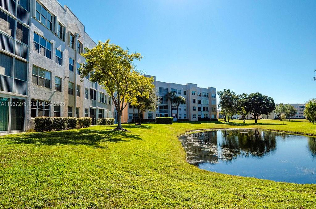 Resort-style 55+ (HOPA) living at its finest in highly sought-after Sunrise Lakes Phase 4—featuring the newest buildings in the community! Enjoy the South Florida lifestyle with a spectacular amenities: golf, pickleball, tennis, fitness center/gym, multiple pools, lakes, basketball, and a stunning 1,000-seat theater shows—plus so much more to keep your calendar full and your days active. This spacious 2-bedroom / 2-bathroom residence is filled with natural light and offers breathtaking panoramic views of the golf course, shimmering lakes, and tennis courts from several rooms—perfect for enjoying sunrise coffee or relaxing evenings with a view. The layout is impressively generous, with large rooms throughout, including a dedicated laundry room with a full-capacity washer and dryer for convenience. The kitchen is both functional and inviting, featuring stainless steel appliances and a charming breakfast area—ideal for casual dining, morning coffee, or hosting friends for brunch. A standout feature is the open pass-through window connection, creating an easy flow and interaction between the kitchen and the living/family areas. Additional highlights include IMPACT WINDOWS, providing peace of mind, energy efficiency, and quieter indoor living. Whether you’re looking for a seasonal retreat or a full-time residence, this penthouse condo delivers the perfect balance of space. Your beautiful home awaits—don’t miss this opportunity to live where every day feels like a vacation!