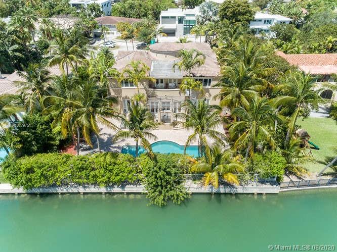 Custom built waterfront home on an oversized property encompassing 1.5 LOTS/14,773 Sq FT  WITH  99FT ON THE WATER.  Offered for the first time, built w/ great attention to detail. Fabulous layout features magnificent 2 story entrance foyer w/ sweeping staircase leading to 5 large bedrooms, Master has 2 oversized walk-ins, sitting area , balcony, state of the art whirlpool & separate shower.  Entertain in the huge formal dining room w/ water views. Chefs kitchen w/fine custom cabinetry, Subzero refrigerator & freezer, 3 ovens, 2 dishwashers & two sets of gas burners . Other rooms include  family room, office w/separate entrance, guest room/bath & second kitchen. Abundant storage not typical in most newly built homes. Take advantage of outdoor living w/ large patio, trellis & heated pool.