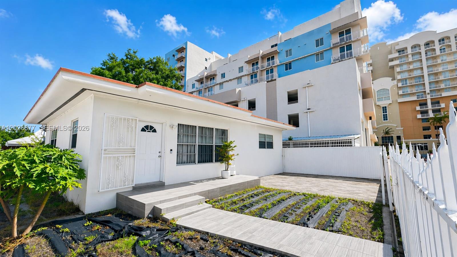 Renovated duplex in Shenandoah/Silver Bluff. Two fully detached structures on a 6,950 SF lot, each 2BR/2BA with separate entrances, gated parking, and central A/C. Combined 1,826 SF of living area. Both units fully leased on annual leases through end of 2026, generating $5,075/mo ($60,900/yr) in gross rental income. Separate water and electric meters. Updated kitchens, bathrooms, and laminate flooring throughout. Ideal for investors seeking stable cash flow in a high-demand Miami submarket.