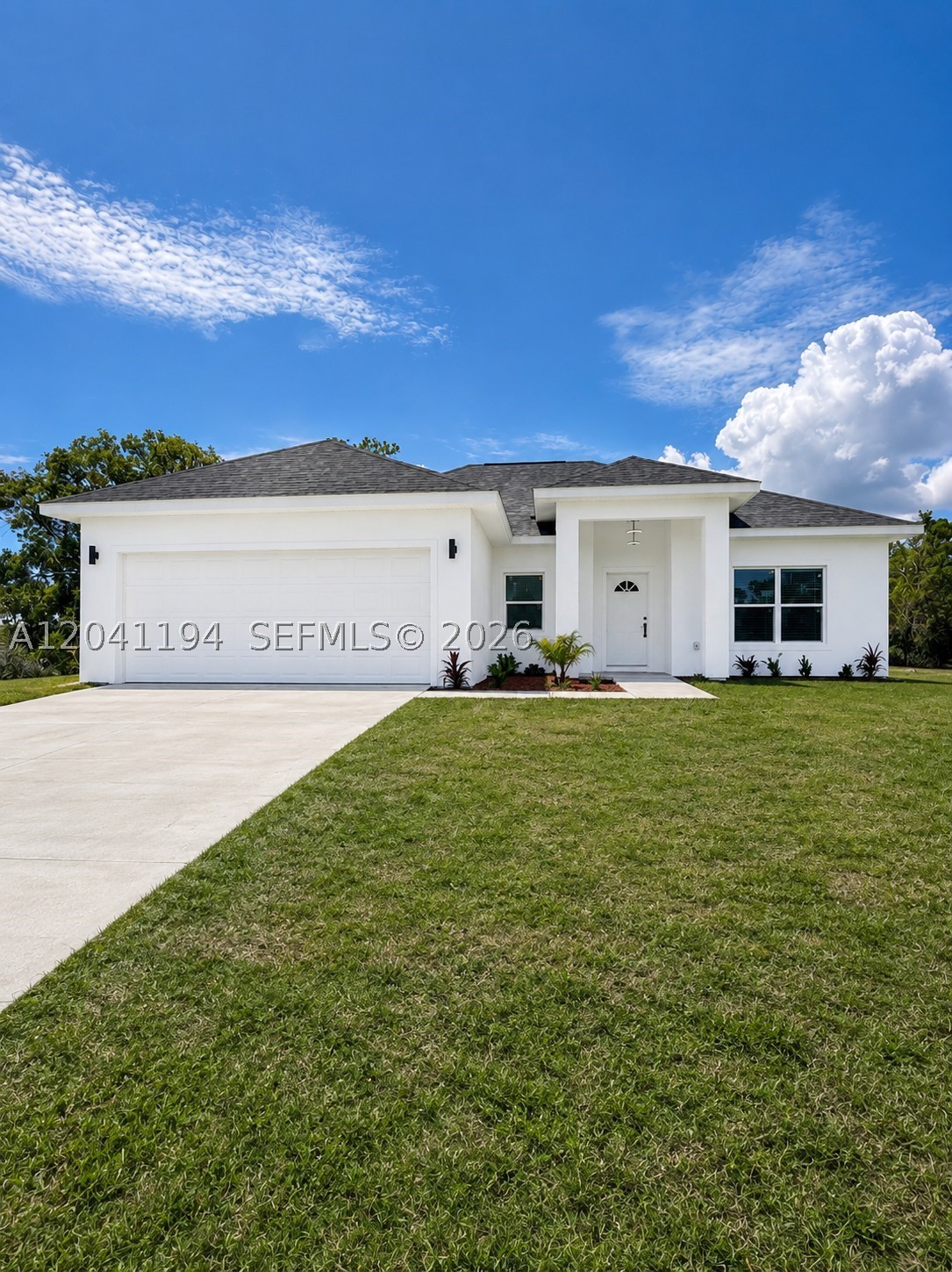 Fall in love with this pristine, brand-new 3-bedroom, 2-bathroom home featuring soaring high ceilings that create an incredibly bright, open, and airy atmosphere. The thoughtfully designed layout boasts a seamless open-concept living space perfect for entertaining, a spacious double garage, a dedicated indoor laundry room, and an automatic sprinkler system to keep your lawn flawless year-round. Tucked away in a quiet neighborhood just minutes from Lake Placid famous freshwater lakes and outdoor recreation—this move-in-ready gem offers the ultimate Florida lifestyle with no municipal city taxes!
