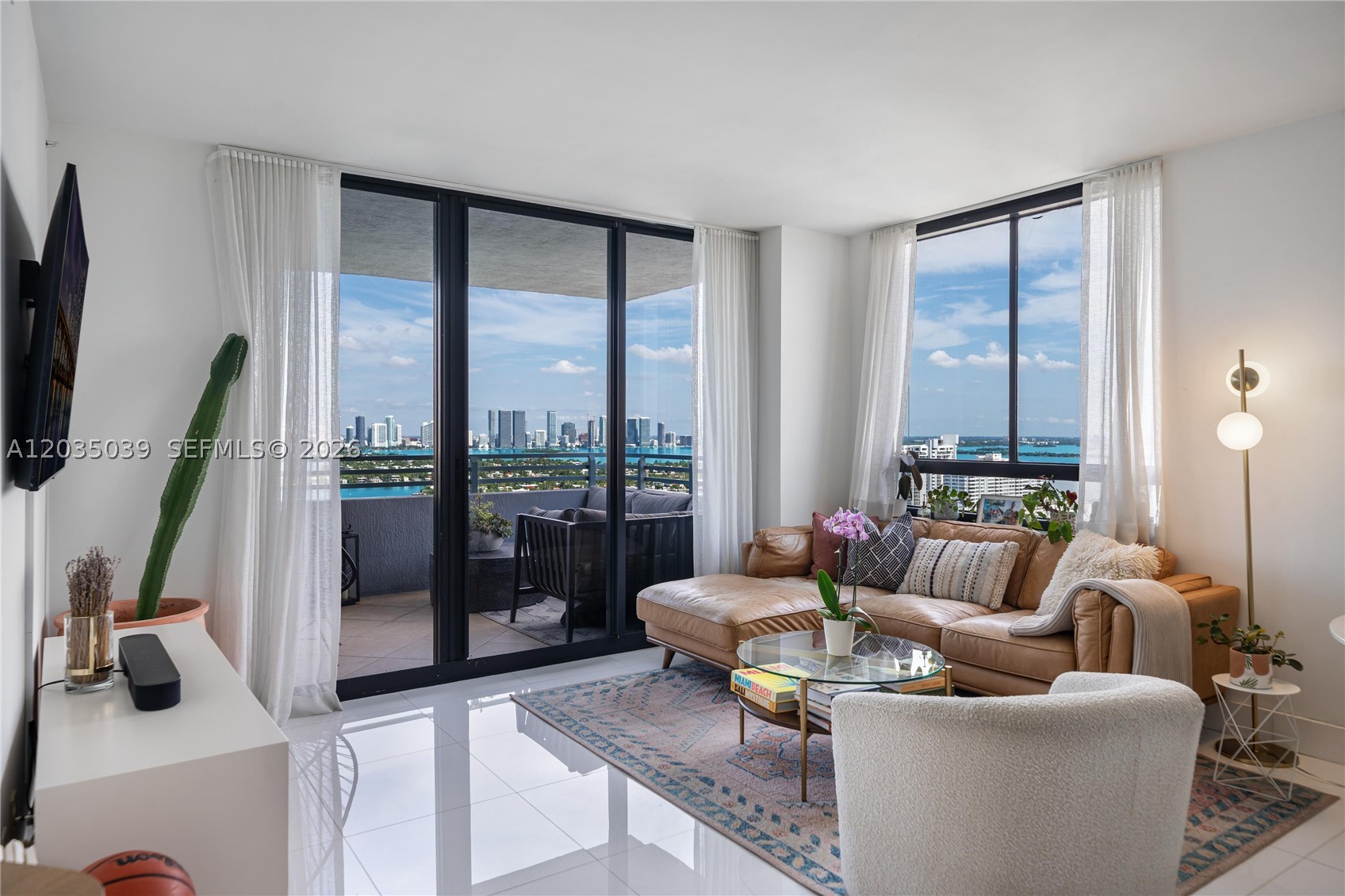 Rarely available "01 Line" corner unit at The Waverly South Beach with unobstructed panoramic views of Biscayne Bay, the ocean, and the Miami skyline. Watch breathtaking sunsets from your private balcony on one of the building's highest floors.
This move-in ready 2-bedroom, 2-bath residence features a custom kitchen, spa-inspired baths, and beautiful white porcelain floors throughout. A full-size washer and dryer are in unit. The split floor plan offers two true master suites, making it as functional as it is elegant.
The Waverly, designed by Arquitectonica, is a newly renovated full-service bayfront building with resort-style amenities including a lagoon pool, fitness center, tennis and sand volleyball courts, outdoor kitchens, koi garden, EV charging stations, party room, valet, concierge, and 24-hour security. One assigned garage space included, plus complimentary valet for a second vehicle. Cable and high-speed internet included. Pet friendly.
All of this steps from Lincoln Road, Trader Joe's, Whole Foods, Sunset Harbor, world-class dining, nightlife, and the beach. West Avenue living at its best.