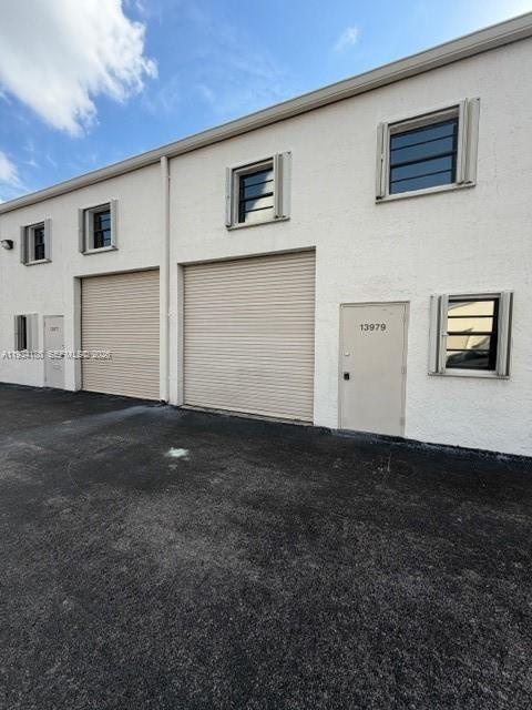 MOTIVATED SELLER!!!  Prime opportunity to acquire two adjacent commercial condo units in a highly sought-after industrial corridor near Tamiami Airport. Units 104 Folio# 30-5922-010-0040 and 105 Folio# 30-5922-010-0050 each unit has 1,090 SF and must be purchased together for a total of 2,180 SF at $700,000. The existing second-floor improvements can be removed, allowing the space to be restored to its original warehouse bay layout. Ideal for owner-users or investors seeking flexible industrial space in the heart of Miami-Dade's active business hub.