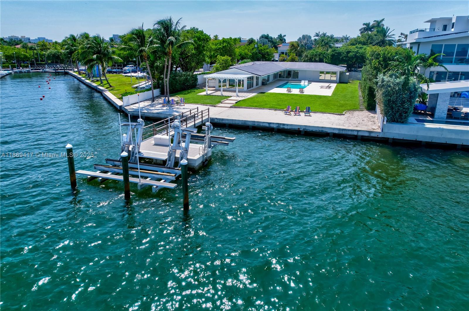 Key Biscayne Waterfront – Unbeatable Location. Experience Miami’s skyline views from your private saltwater pool and man-made beach. This elegant four-bedroom residence features marble floors, impact-glass windows, and a modern open kitchen filled with natural light. Enjoy two electric boat slips, direct water access for kayaking or paddleboarding, and a spacious two-car garage. Currently leased until December 1, 2025.