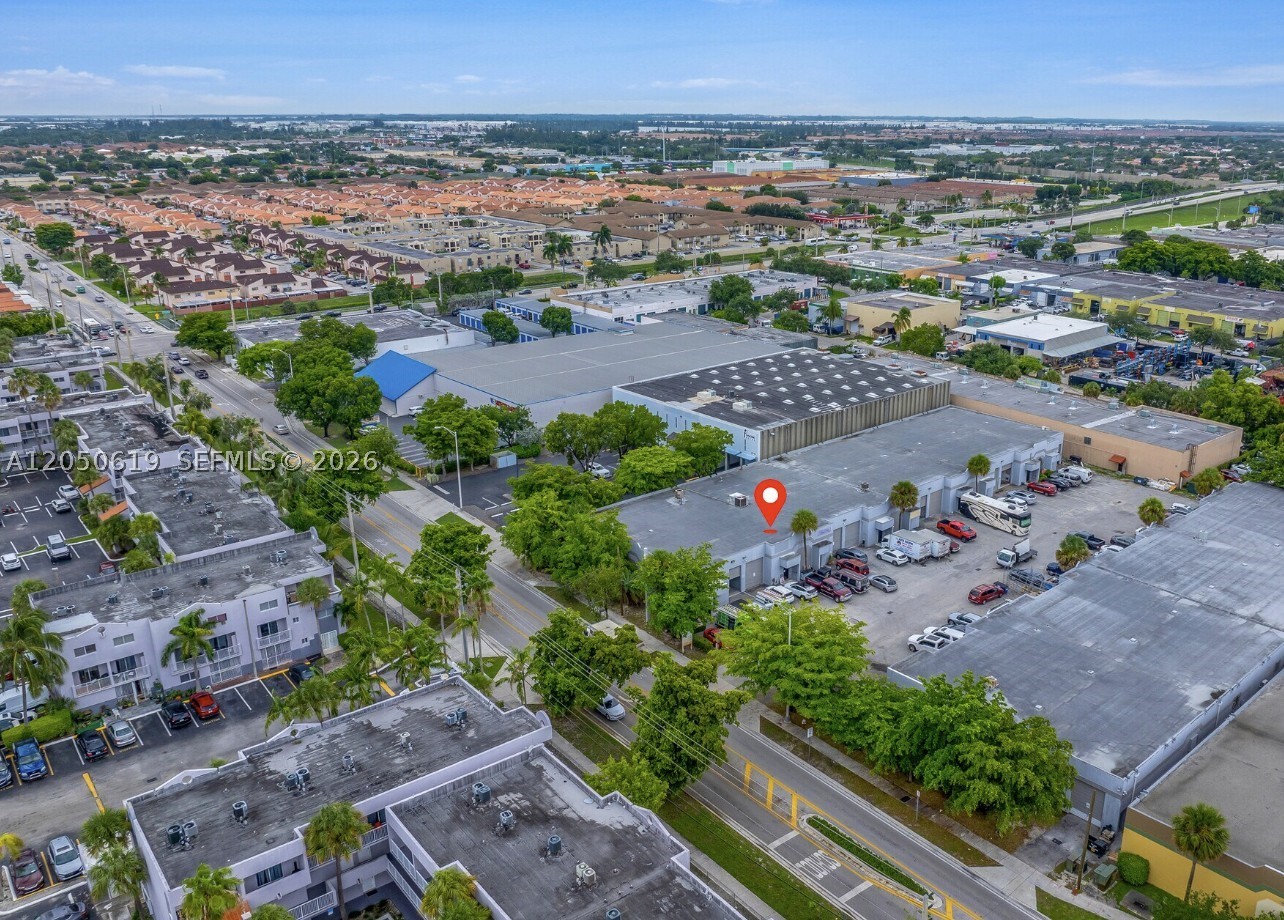 The property features one street-level drive-in bay door, approximately 18-foot clear ceiling height, reinforced concrete construction, and two assigned parking spaces. The entire warehouse is fully air-conditioned, with a new central A/C unit installed in 2025, making it ideal for businesses requiring climate-controlled space such as light manufacturing, distribution, showroom, e-commerce, medical storage, printing, technology, assembly, or specialty operations.