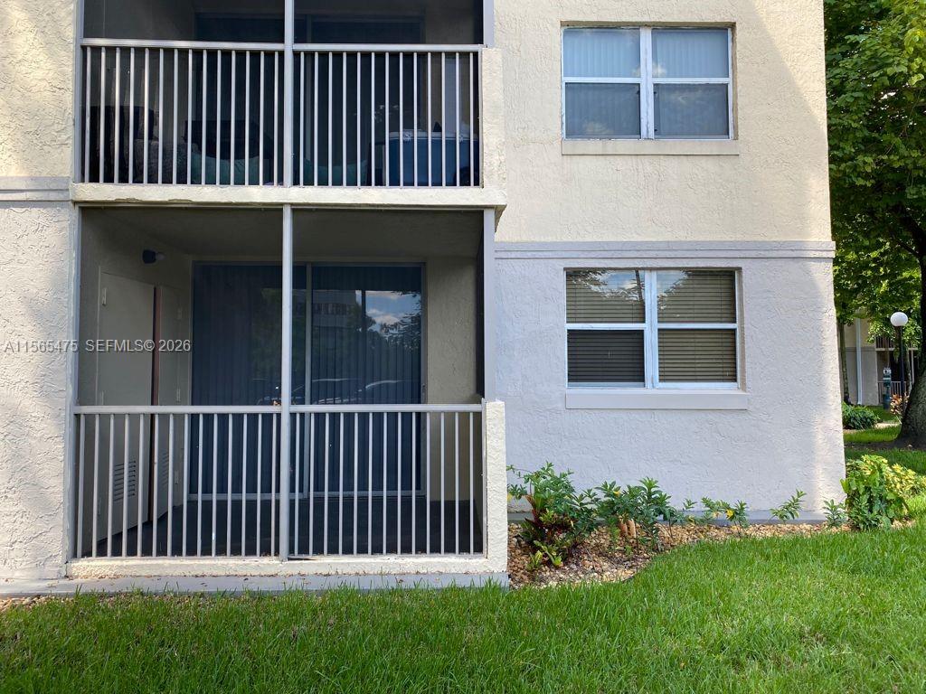 Priced to sell! Experience the rare comfort and privacy of a house in this oversized 810 Sq. Ft. ground-floor corner unit. Completely renovated and remodeled, this bright 1BR/1BA residence features modern laminate flooring throughout, a large walk-in closet, an in-unit washer/dryer, a private screened balcony with extra storage, and 2 parking spaces. Low HOA fees and fantastic resort amenities. Secure gated community, making this an ideal property for living or investment. Perfectly positioned in the heart of New Doral, just minutes from CityPlace Doral and Downtown Doral, surrounded by world-class dining, upscale shopping, and vibrant entertainment.