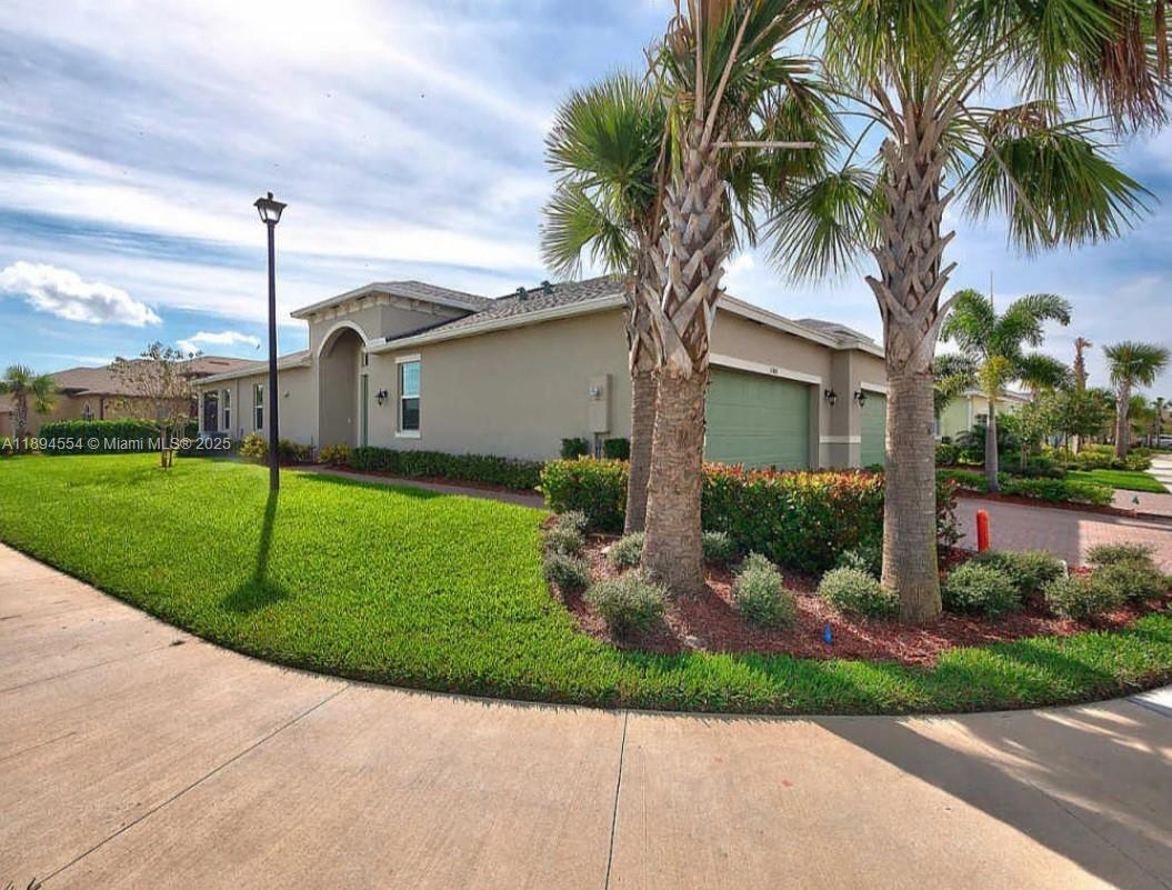 Beautifully kept Buttonwood model in Lake Park at Tradition, a premiere 55+ community. This CBS built villa offers 2BR, 2BA + Den  with a 2 car garage. The interior features stainless steel appliances with tiles throughout the villa. Master bedroom has a spacious bathroom with dual sinks and separate shower with a walk-in closet. Large separate laundry/utility room with a linen closet. Enjoy the FL weather under the covered and screened lanai. HOA includes Lawn Care, Ext. Pest Control, Cable, Hi-Speed Internet, Home Phone, Alarm Monitoring and much more amenities at the Clubhouse.
