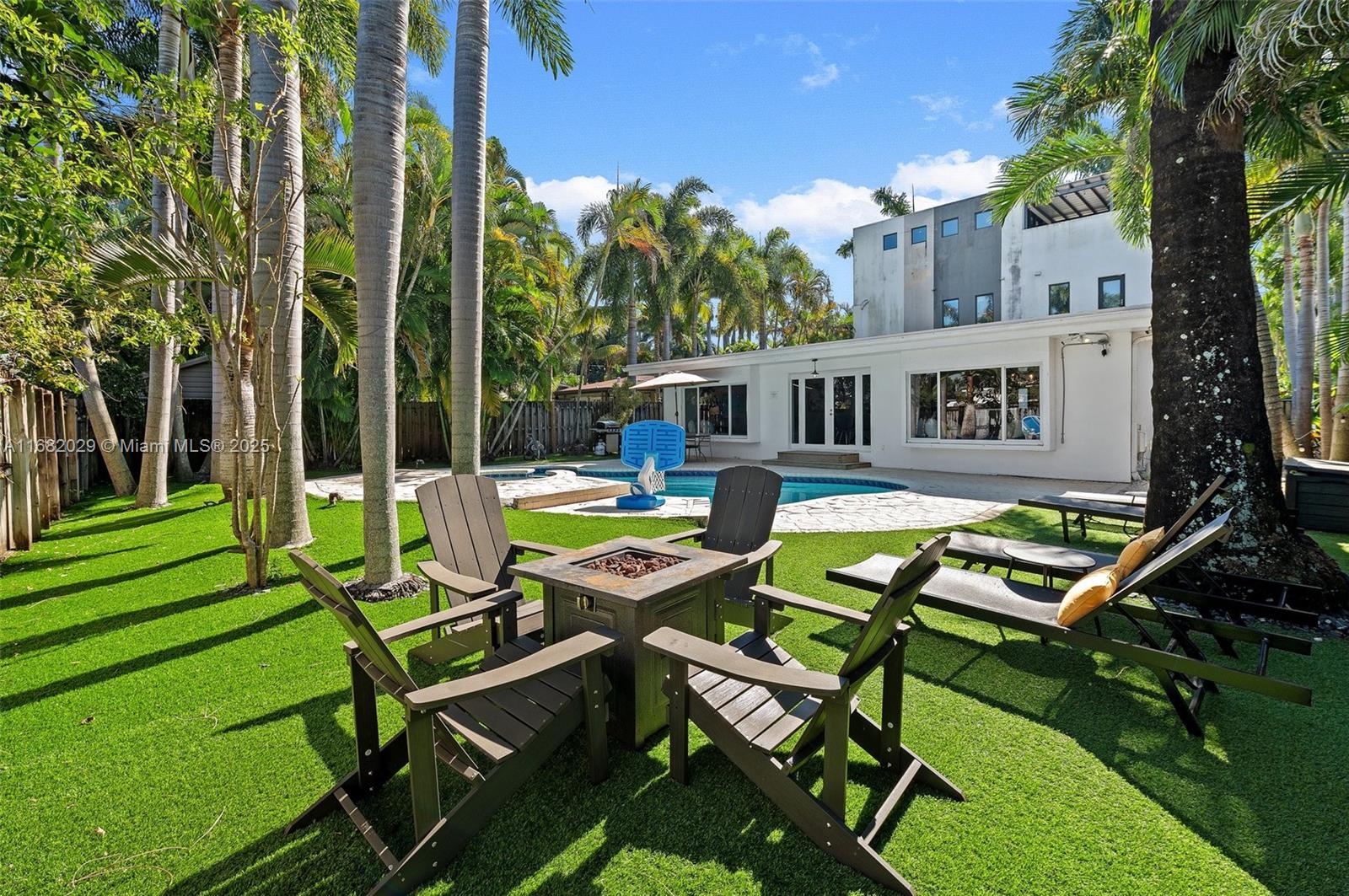Experience the epitome of luxury living in this tropical contemporary home, nestled on lush Hollywood beach area. Enter through a soaring high ceiling foyer to an open layout living areas with luxurious finishes, surrounding an expansive and inviting interior. A perfect blend of contemporary design with tropical backyard makes this home an entertainer's oasis. Relax or dine by your pool or have a glass of wine by firepit. And at night enjoy your rooftop where views of dramatic sunsets will take your breath away. Perfectly located just few blocks away from Hollywood circle and beaches. Just 15 min away from FLL.