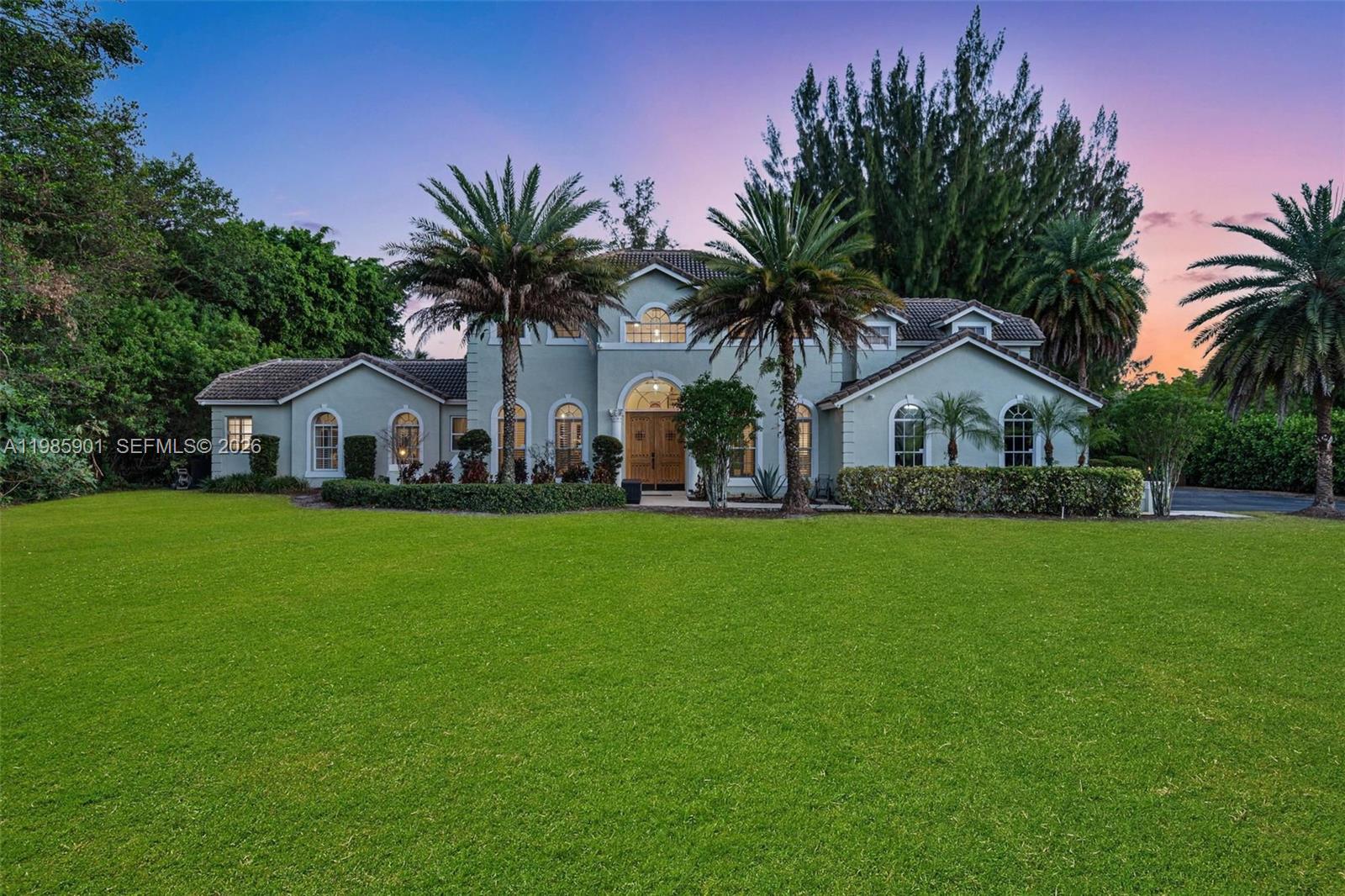 Elegant Country Estate in Prime Location! This expansive 8BR/4.5BA pool home sits on nearly 2 acres, offering endless potential for investors seeking income, multi-generational living, or a luxury retreat. Featuring a grand double-door entry, spacious and flexible floor plan, and refined finishes throughout, this well-maintained residence is ideal for maximizing rental or resale value. Gated entrance with lush landscaping leads to a 3-car garage, plus a 3-bay pole barn—perfect for additional storage, business use, or future enhancements. Southern rear exposure ensures full-day sun over the pool and outdoor areas, creating a highly desirable setting for tenants or guests. Located in the exclusive Hillsboro Pines community, a peaceful country-style enclave just minutes from major highways, shopping, and close to Deerfield Beach and the Atlantic Ocean. Rare acreage + high bedroom count = exceptional income potential. A standout asset in a rapidly growing area!