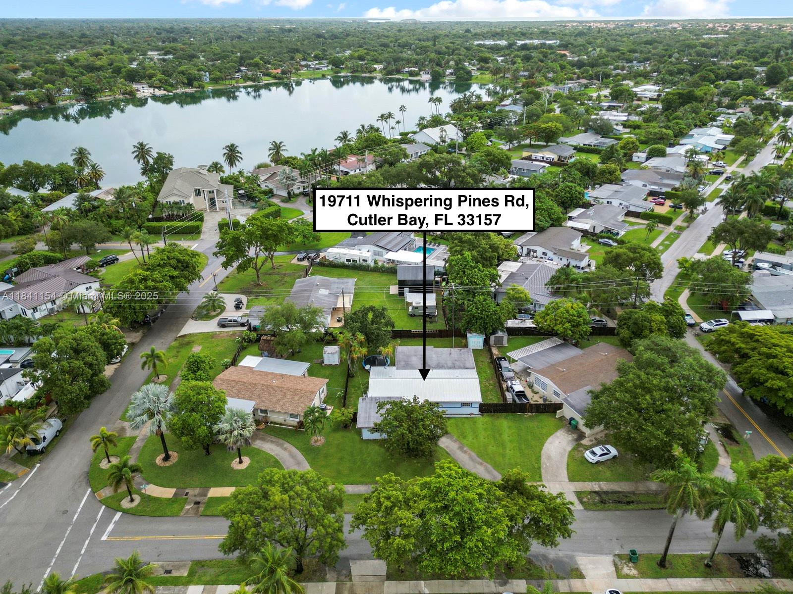 Major price improvement! Best value for a 5- bedroom home in the area- schedule your showing today. NO FLOOD ZONE. Spacious 5-Bedroom, 2-Bathroom home (2130 living square feet) just one block from beautiful Whispering Pines Lake in the heart of Cutler Bay. This well-maintained home features a newer metal roof, updated kitchen, and new tile flooring throughout. Flexible floor plan with an oversized additional room off the primary bedroom- perfect for a sitting area, nursery, home gym, or private retreat. Front room with private entrance ideal for a home office, guest room, or additional bedroom. Enjoy a private backyard perfect for entertaining with plenty of room for a boat or RV, plus a detached shed with electric- ideal for a workshop, storage, or hobby space.  Our Cutler Bay community has many family events like golf cart parades, chili cook-offs, wing- fests plus much more. Located near downtown Cutler Bay, the Turnpike, popular Black Point Marina, and the $1 billion redevelopment of Southland Mall to Southplace City Center.