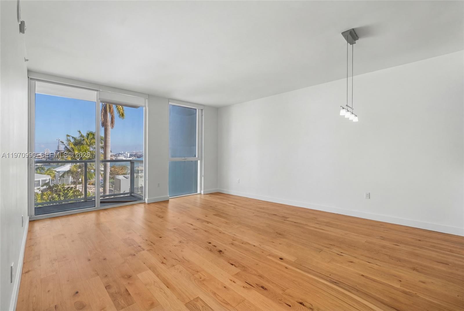 Live in the heart of Downtown Miami at Vizcayne South. This beautiful one bedroom, one bath residence on the 10th floor offers views of Biscayne Bay, complemented by serene pool views that create a true sense of coastal living. Floor to ceiling impact widows flood the space with natural light while warm wood floors add comfort and style throughout. The open kitchen features modern cabinets and stainless steel appliances, seamlessly connecting to the living area, perfect for relaxing or entertaining while enjoying the bay views. Vizcayne South offers resort style living with two sparkling pools, a luxury spa, fully equipped fitness center, sauna and steam room, club room, billiard room, business center, and a 24hrs concierge service.