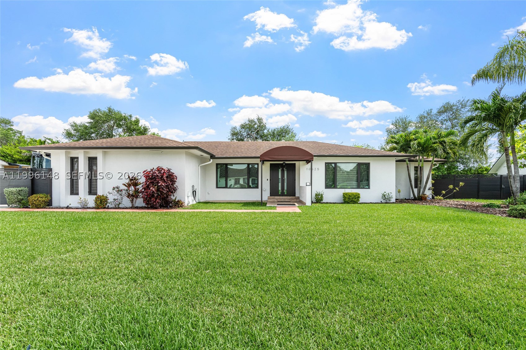 Rare opportunity to own a beautifully renovated home located on a quiet cul-de-sac in highly desirable East Kendall. This private, fully fenced property features gated entry and a spacious layout. The home offers 3 bedrooms, 2 bathrooms, and a 2-car garage, along with an expansive driveway with ample space for multiple vehicles, boat, or RV parking. Inside, enjoy a modern open-concept design highlighted by a stunning chef’s kitchen with an oversized island, abundant cabinetry, and upgraded appliances, all flowing into bright and spacious living areas. Additional features include impact windows and doors, updated systems, and a dedicated laundry area.
Step outside to a large screened-in patio and open backyard complete with outdoor entertaining space, and mature landscaping. Ideally located just minutes from major highways, shopping, dining, and hospitals. A unique combination of privacy, location, and modern upgrades.