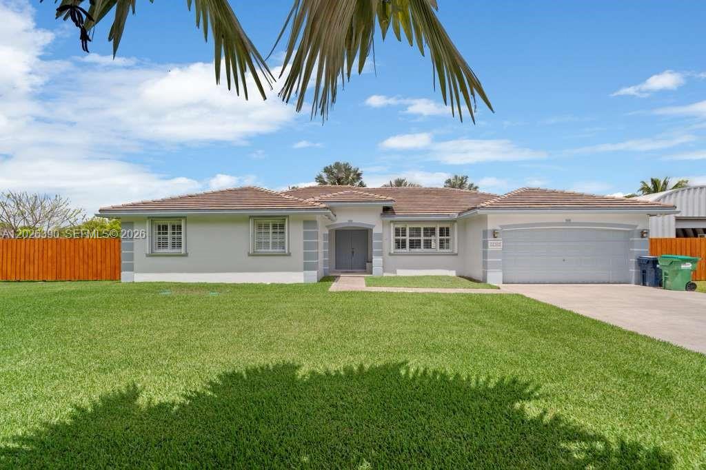 Beautifully remodeled home located in the desirable Emerald Greens community of Homestead! Situated on an oversized 0.45-acre lot, this spacious property offers nearly 3,000 total SF with plenty of room for entertaining, boats, RVs, or future additions. The home features a fully updated interior with quartz countertops, new kitchen cabinets, updated appliances, remodeled kitchen and bathrooms, and elegant white tile flooring throughout. Roof is approximately 7 years old with durable flat tile roofing, plus accordion shutters for added storm protection and peace of mind. Step outside to your private backyard oasis complete with a sparkling pool, expansive patio space, and mature tropical landscaping—perfect for enjoying South Florida living year-round. Quiet neighborhood with no HOA and convenient access to the Turnpike, shopping, dining, and the Florida Keys!