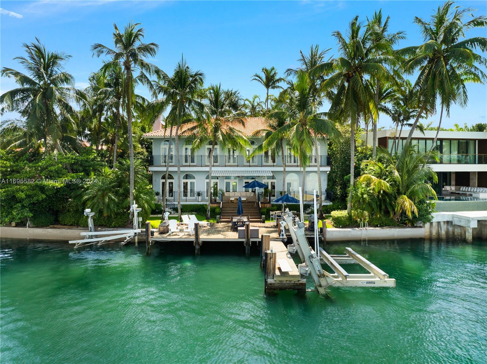 Experience unparalleled luxury on one of the finest lots in the Venetian Islands. Situated on oversized corner lot and spanning 13,383 square feet, this property boasts an impressive 106 feet of waterfront. Located on the tranquil point of Dilido Island, this property captivates with unobstructed picturesque western bay views of the Miami skyline. This exquisite 4-bedroom, 5-bathroom home has been meticulously renovated and includes a separate guest house. A private oasis awaits in the beautifully landscaped front yard and pool area, entirely secluded from the street. Enjoy soaring ceilings throughout, an expansive master suite with generous walk-in closets, and a lavish windowed master bath designed for indulgence. Schedule a showing today!!
