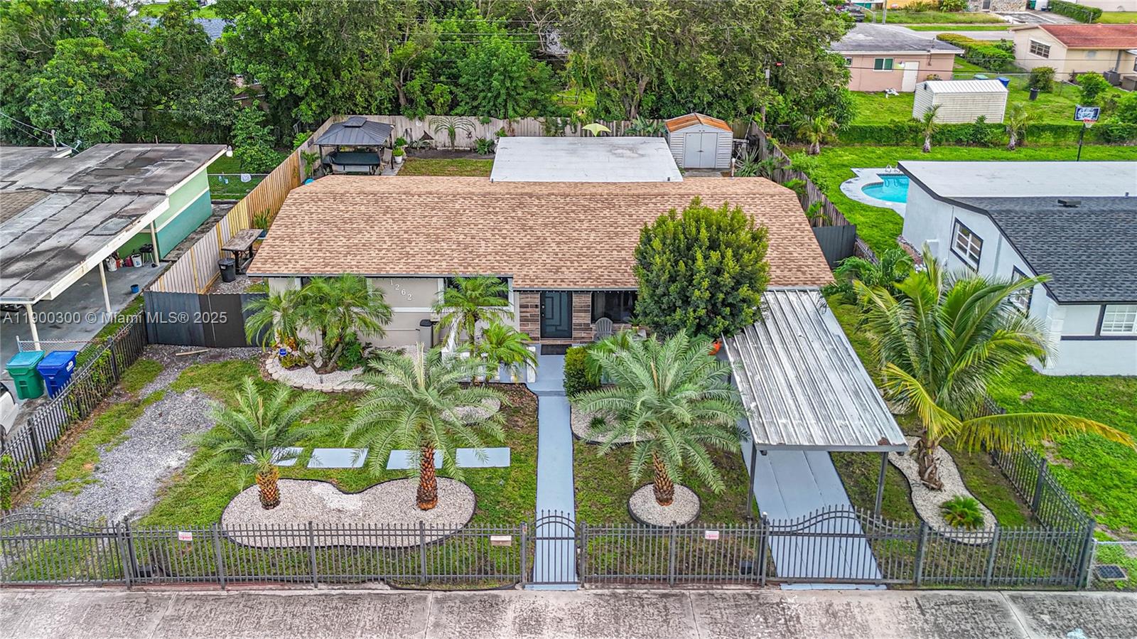 Beautiful Home in an Excellent Location – Miami Gardens. Discover this charming property located in a prime area of Miami Gardens, perfect for those seeking comfort, style, and investment potential. The home features a new roof installed in 2023, a modern kitchen with granite countertops, porcelain tile floors, and impact doors and windows throughout, offering both elegance and security. Enjoy a spacious carport and a large parking for multiple vehicles or space for an RV, providing the perfect combination of comfort and functionality.In addition, the property includes a Studio/Den with a private entrance, offering excellent potential to add a second bathroom and convert it into an independent unit to generate rental income.